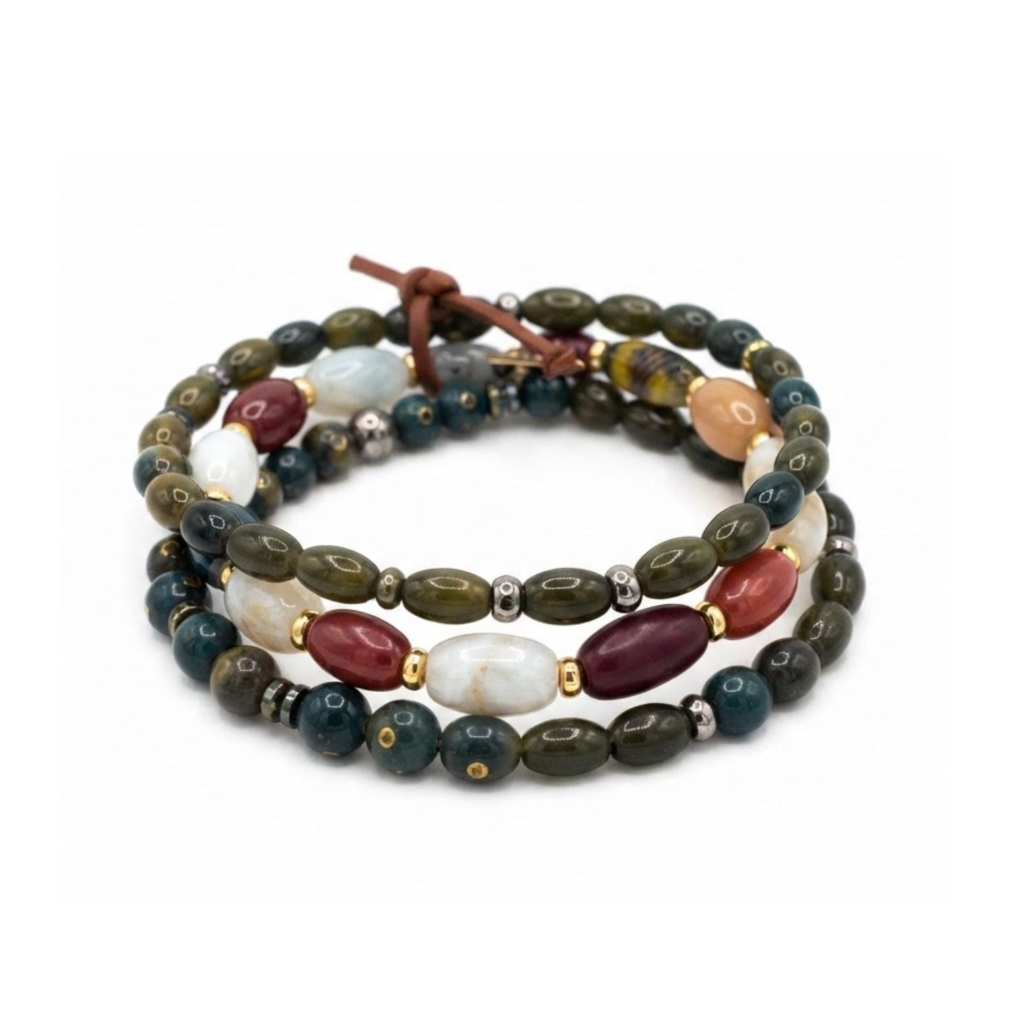 High-resolution studio product shot of the JAREDJAMIN Silvan Men's 3-Piece Stackable Bracelet Set displayed flat against a white backdrop, highlighting the green oblong wood, round jasper, oval football-shaped quartz beads, and signature brown leather tie.