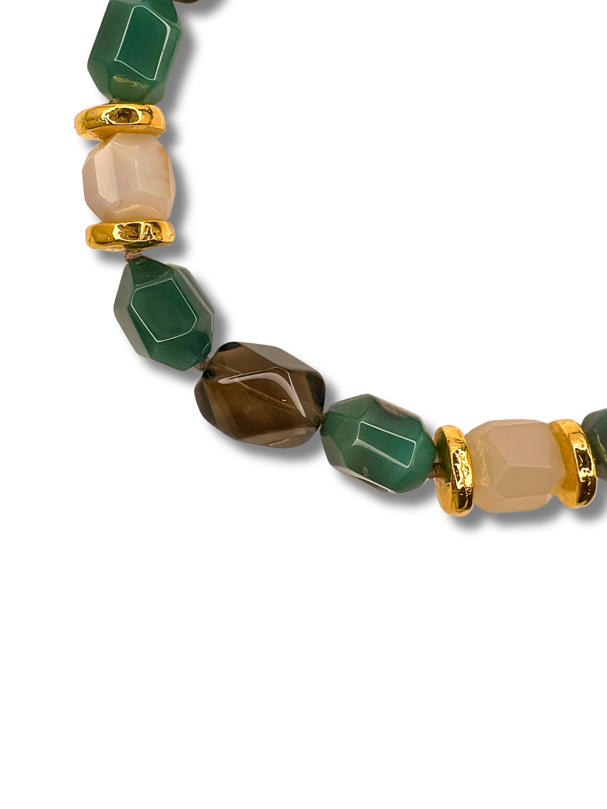 The Green Dream Necklace from JAREDJAMIN Jewelry Online features a striking statement design with hexagonal green agate beads, faceted brown and beige beads, and small gold spacers. Ethereal smokey clear quartz accents add elegance, partially visible against a plain white background.