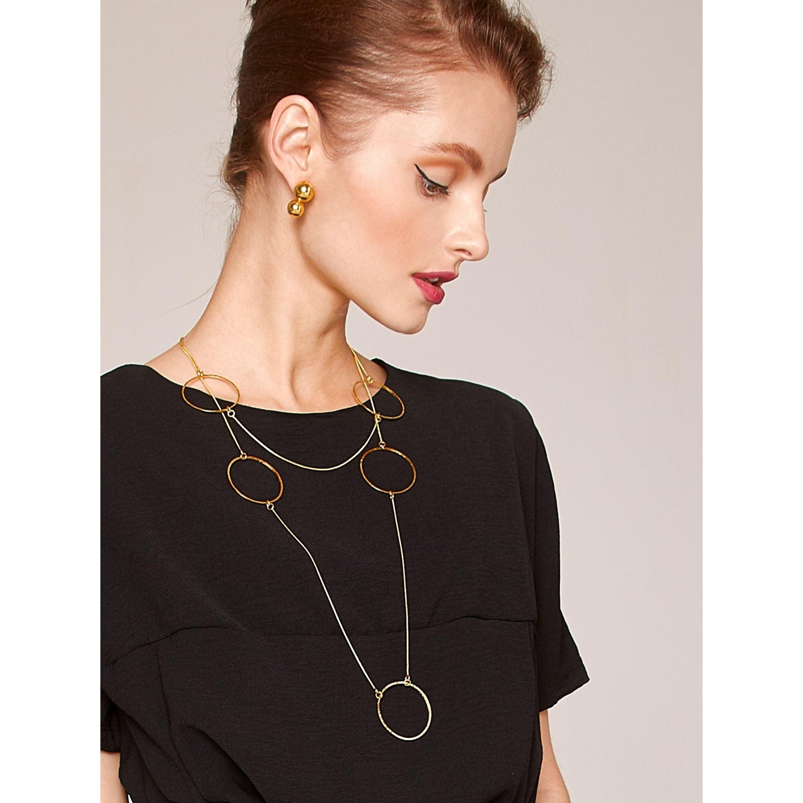 The Halo Lindy Textured Gold Hoop Necklace by JAREDJAMIN Jewelry Online features a thin gold snake chain with six large, evenly spaced circular 18K gold links, arranged simply and elegantly against a white background.