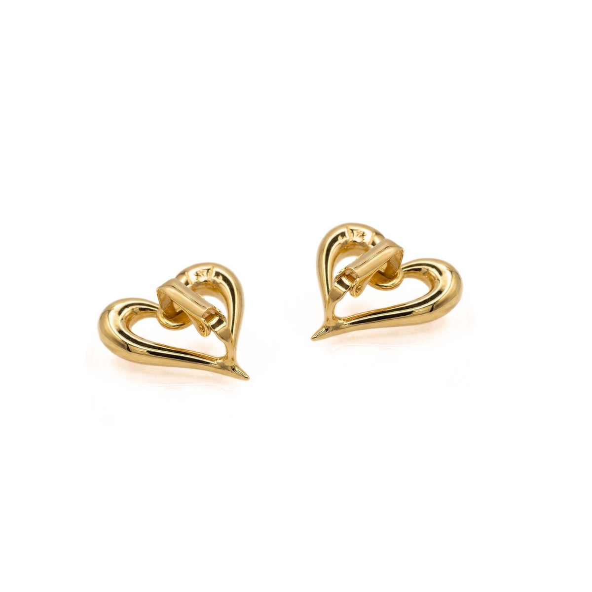 Heartfelt Earrings: Sculpted gold heart studs, hand-assembled in our West Hollywood studio. Each open form punctuates the lobe with subtle warmth—crafted in small batches using eco-conscious materials. Style note: moves seamlessly from crisp denim to silk tailoring.