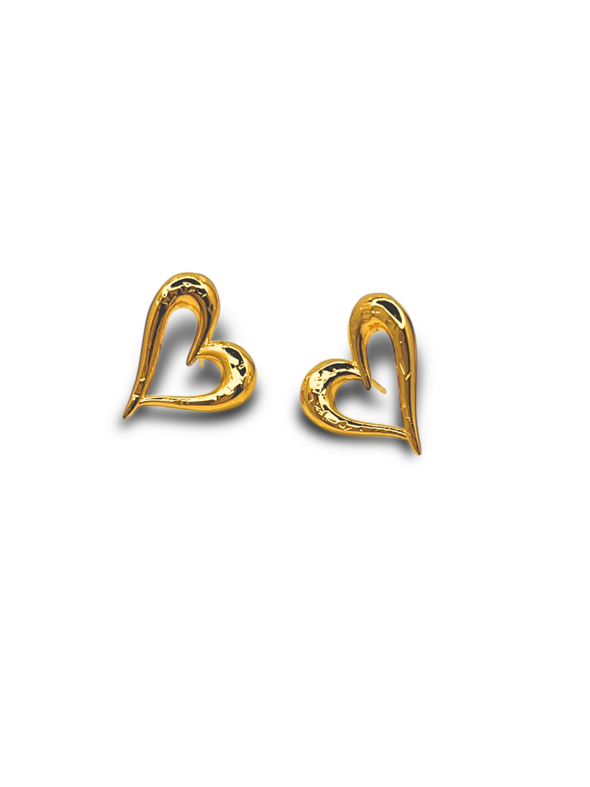 JAREDJAMIN Jewelry Online&#39;s Heartfelt Earrings capture timeless romance with their gold, heart-shaped design. One curves left, the other right, each with a smooth surface and hollow center on a white background—an unforgettable gift for any occasion.