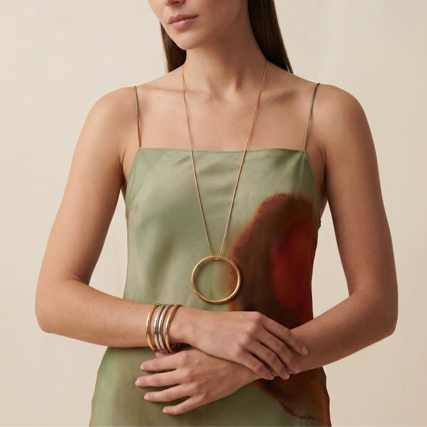 The Heavenly Hoop Bangle Pendant from JAREDJAMIN Jewelry Online shines on a white background, ideal for stacking with bangles or pairing with gold and silver charms.