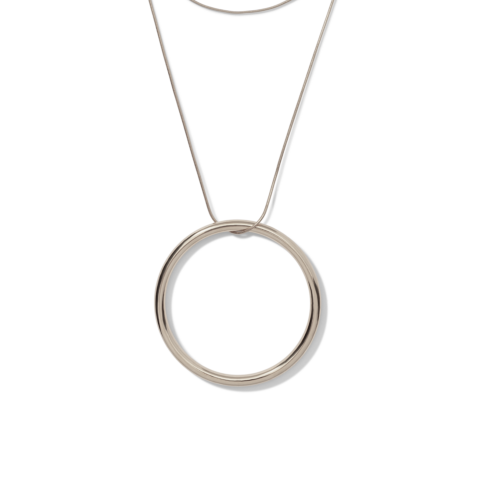 The Heavenly Hoop Round Pendant Necklace by JAREDJAMIN Jewelry Online features a minimalist 18K gold-tone snake chain and a smooth circular pendant. Its polished gold finish and modern design stand out on a white background.
