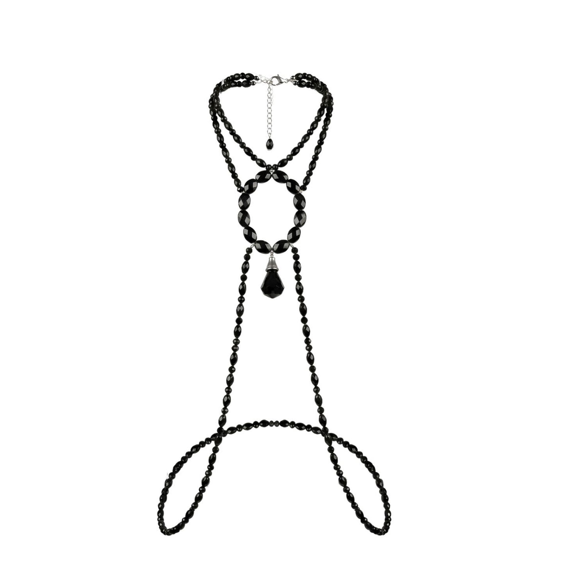 Flat lay on a white background of the Hera body necklace: multiple strands of small faceted black beads, a large oval ring of bigger faceted black beads, a black crystal teardrop pendant hanging from the ring's center, and long beaded strands looping below to wrap around the torso.
