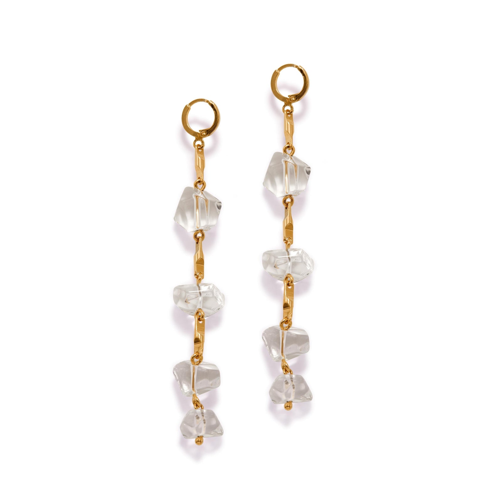 The Ice Dangle Gold Leverback Earrings by JAREDJAMIN Jewelry Online feature three clear, irregular crystal-like stones linked vertically by gold bars, blending metallic and translucent elegance in a modern statement design.