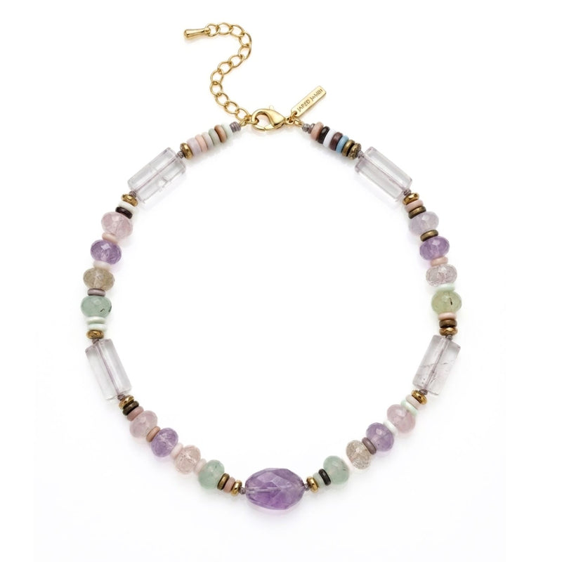 High-resolution studio shot of the Iris Amethyst and Multi-Gemstone Necklace arranged in a perfect circle, displaying the raw mineral textures of the quartz columns, the hand-knotted construction between focal stones, and the 18k gold-plated hardware.