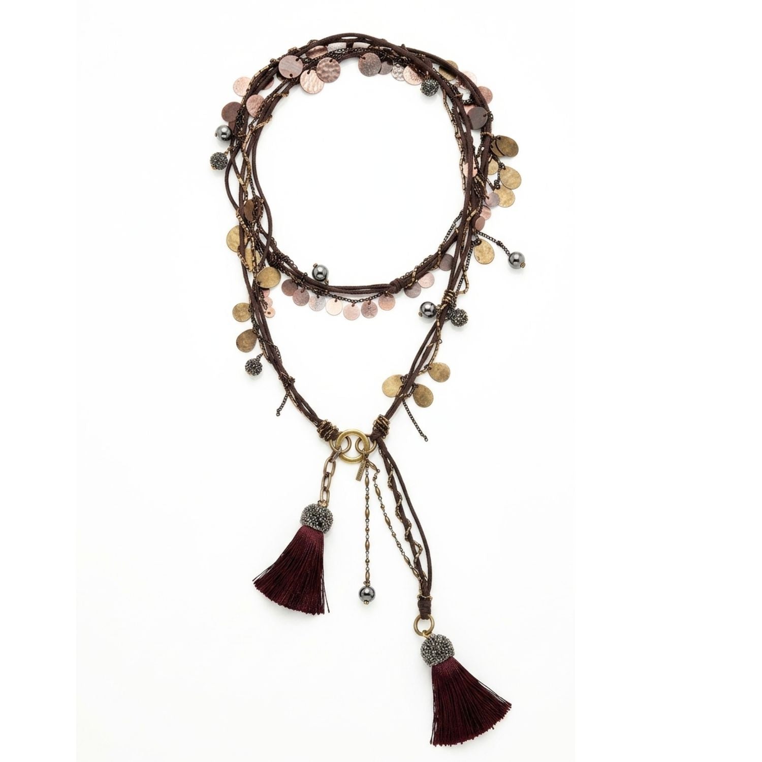 Sahara brass and copper tassel phone lanyard laid flat, showing the brown woven cord, vintage chains and charms, bead strands, and two brown tassels with pave crystal caps