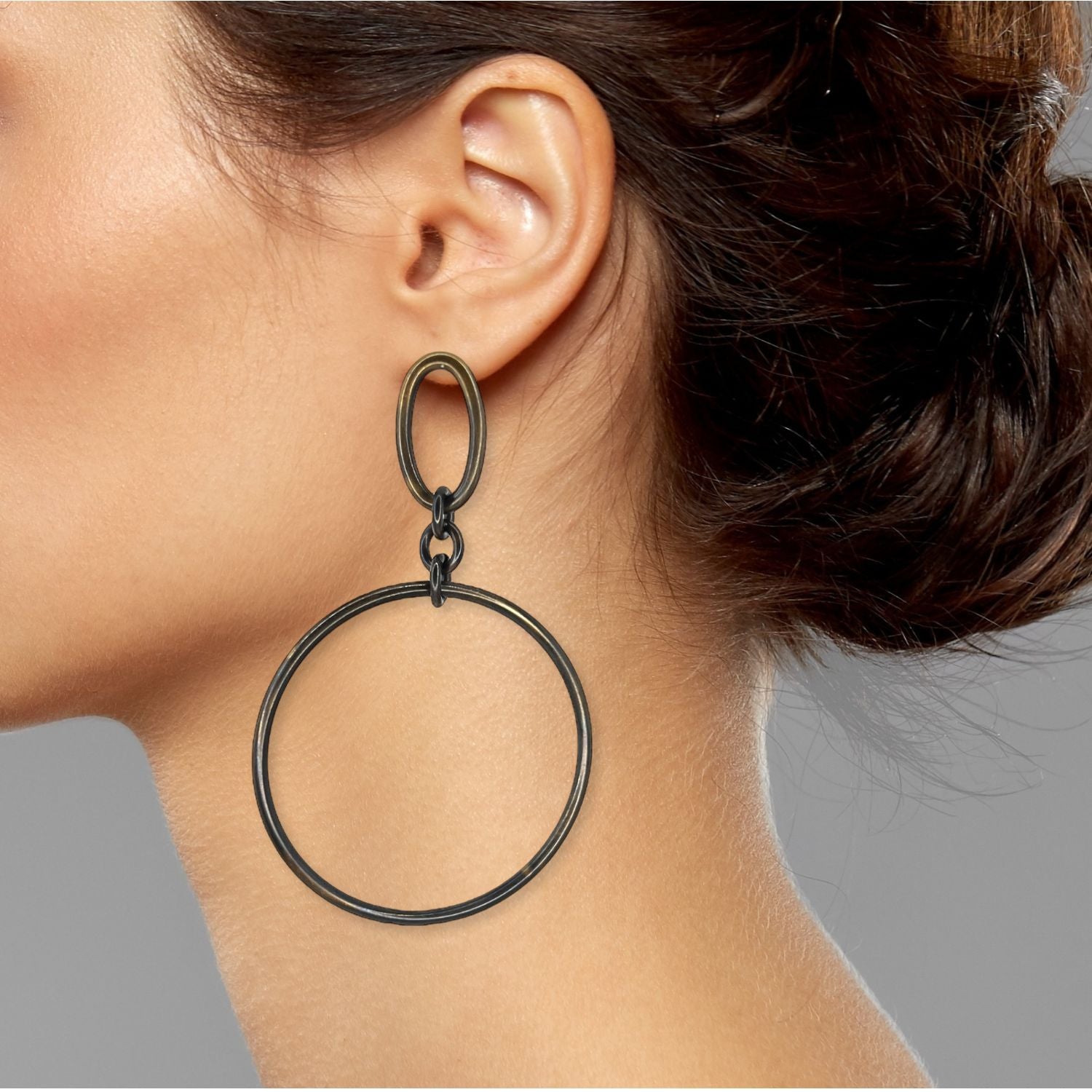 A pair of Antique Ophelia Drop Hoop Post Earrings by JAREDJAMIN Jewelry Online, each featuring a small oval loop atop a thin large circular hoop, are displayed at slight angles on a plain white background.