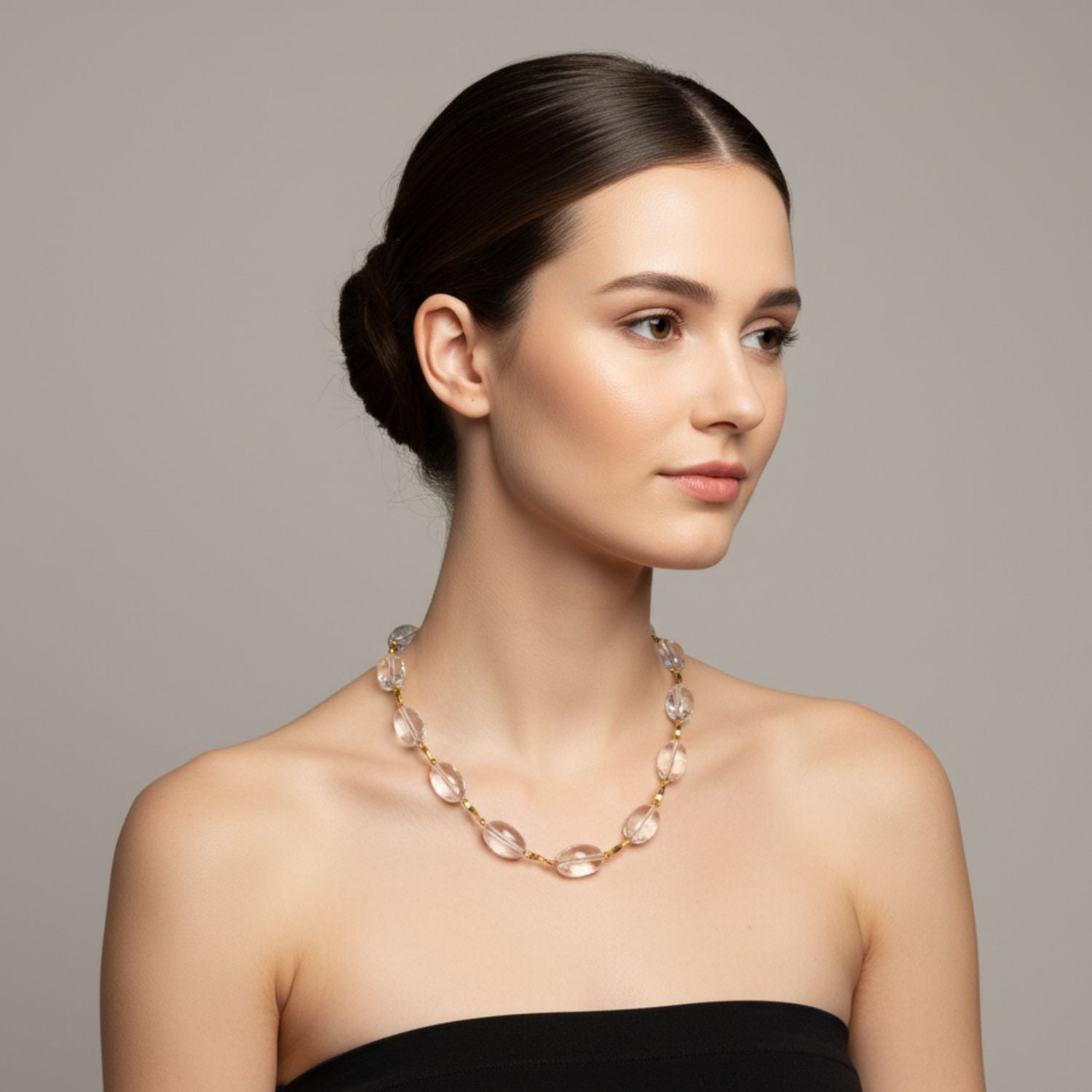 The Arctic Gold Bar-Link Necklace by JAREDJAMIN Jewelry Online features clear Crystal Quartz beads set along an 18K gold-plated chain with a gold toggle clasp, combining alternating gold links and translucent stones for a minimalist, elegant style.