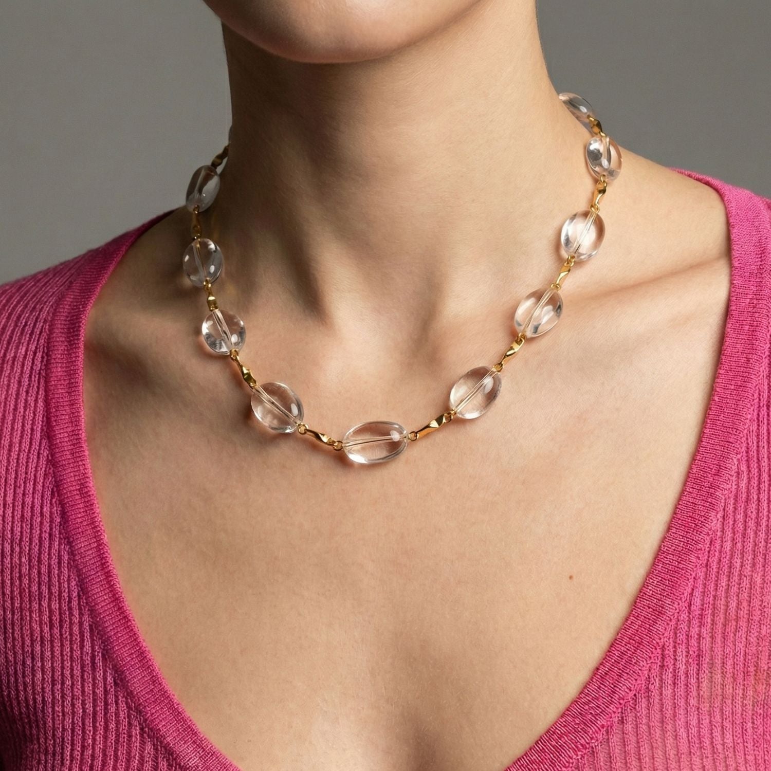 The Arctic Gold Bar-Link Necklace by JAREDJAMIN Jewelry Online features clear Crystal Quartz beads set along an 18K gold-plated chain with a gold toggle clasp, combining alternating gold links and translucent stones for a minimalist, elegant style.