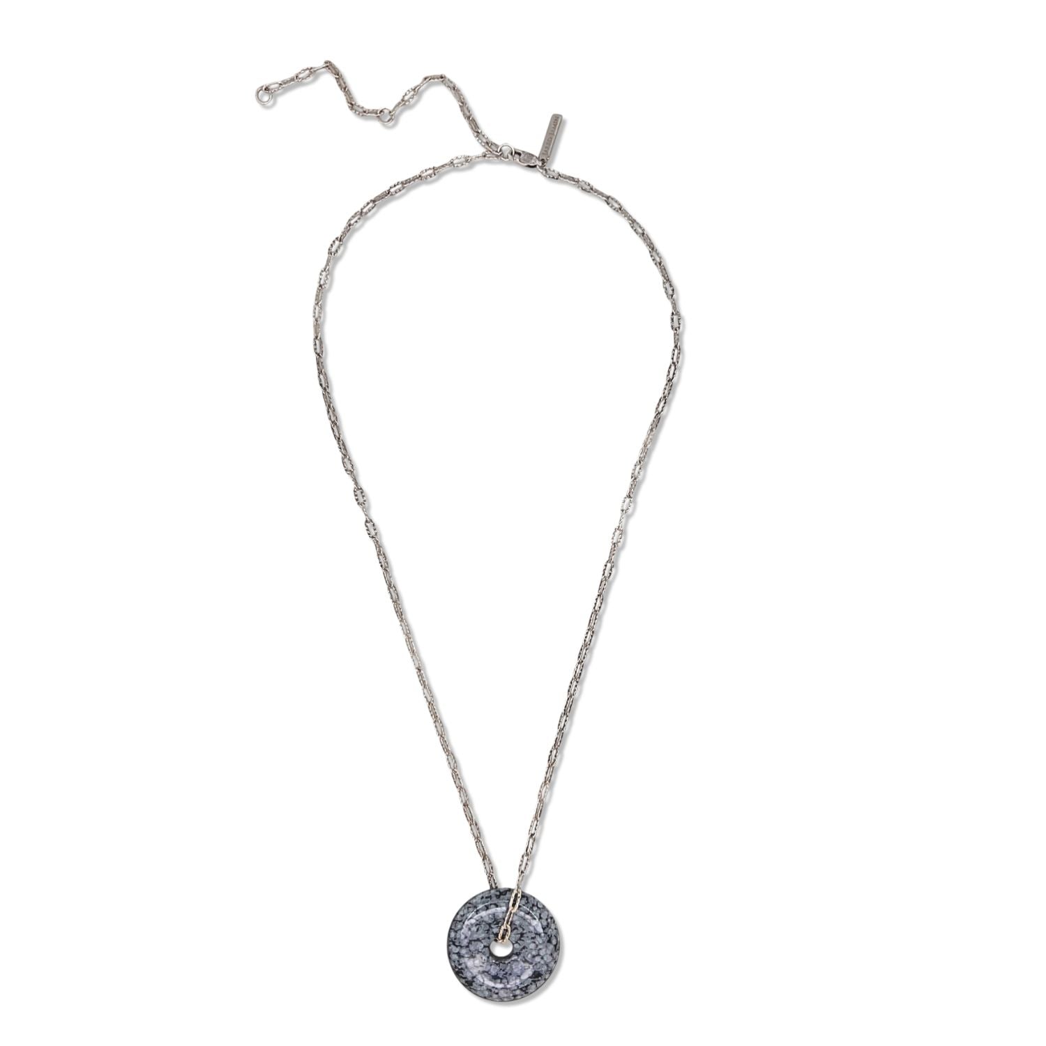 The Ash and Or Sterling Silver Necklace from JAREDJAMIN Jewelry Online showcases elongated links, a round gray-black marbled jasper pendant with a central hole, and an adjustable unclasped design with a slender bar fastening.