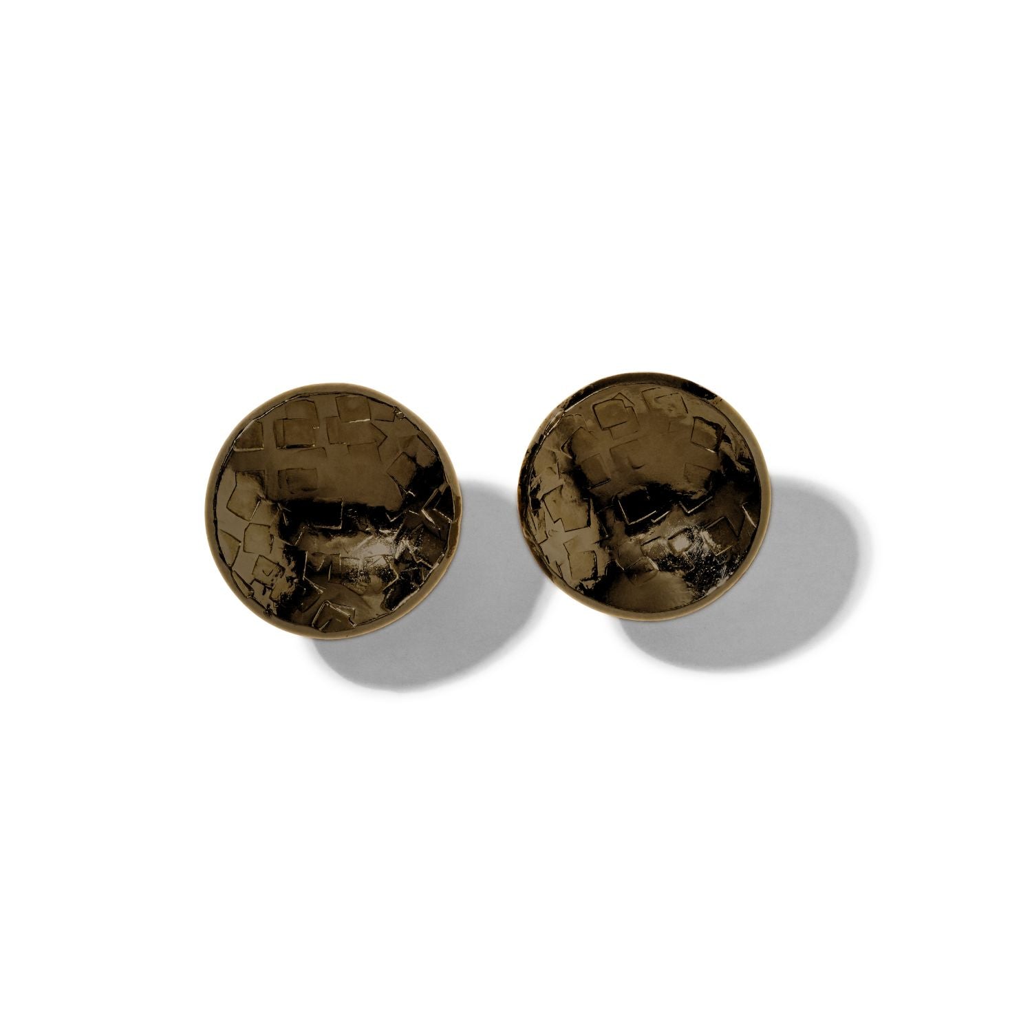 The Buttercup Antique Textured Stud Post Earrings by JAREDJAMIN Jewelry Online feature a round, dark metallic look with hammered and abstract geometric textures, shown on a white background casting soft oval shadows.