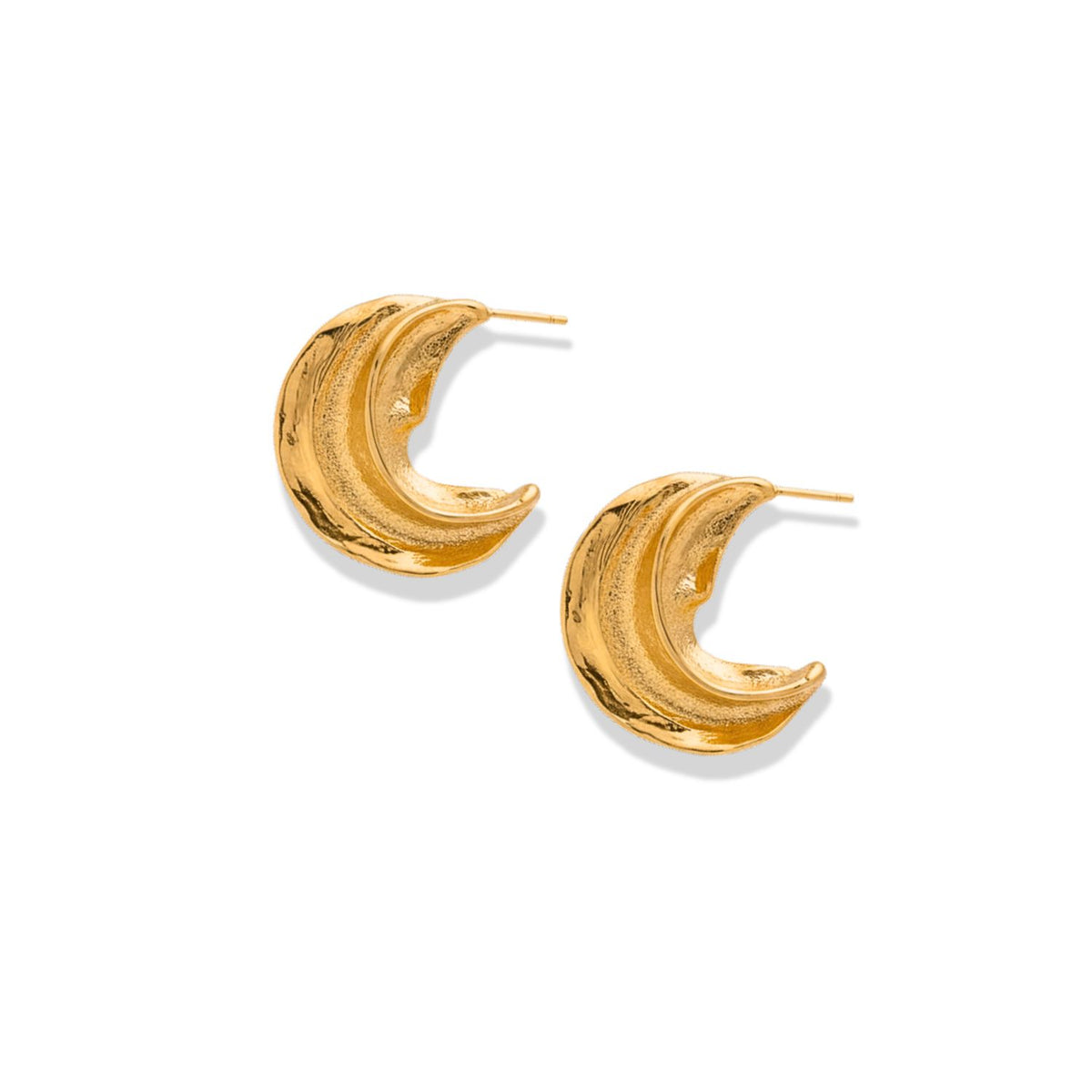 The Cressida Gold Hoop Earrings by JAREDJAMIN Jewelry Online are crescent-shaped, textured gold semi hoops. Lightweight with visible posts, these bold earrings have a wavy, three-dimensional design and are shown on a white background.