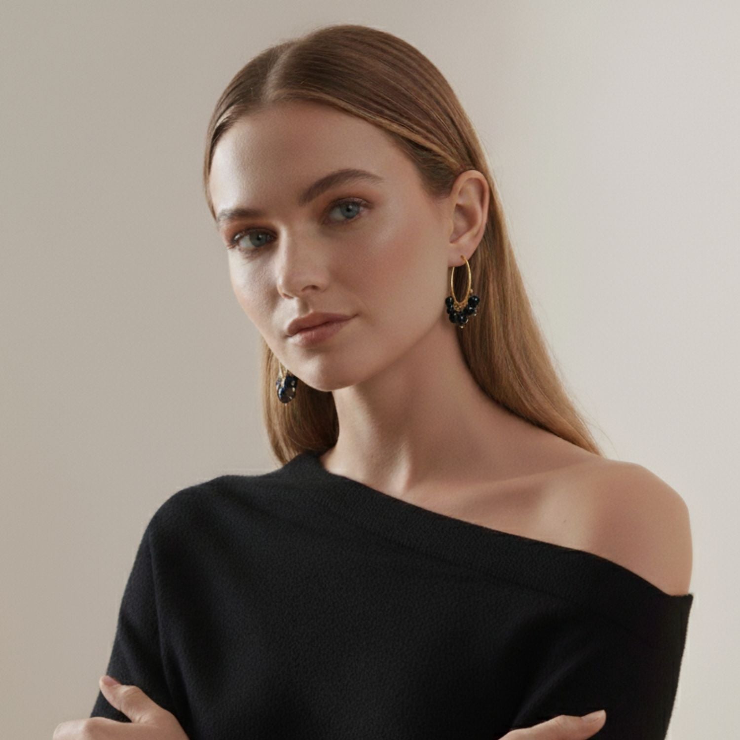 The Daniela Hoop Onyx Earrings by JAREDJAMIN Jewelry Online feature 18K gold hoops with six evenly spaced round onyx beads on each, attached by small gold links and secured with a latch closure, shown against a white background.