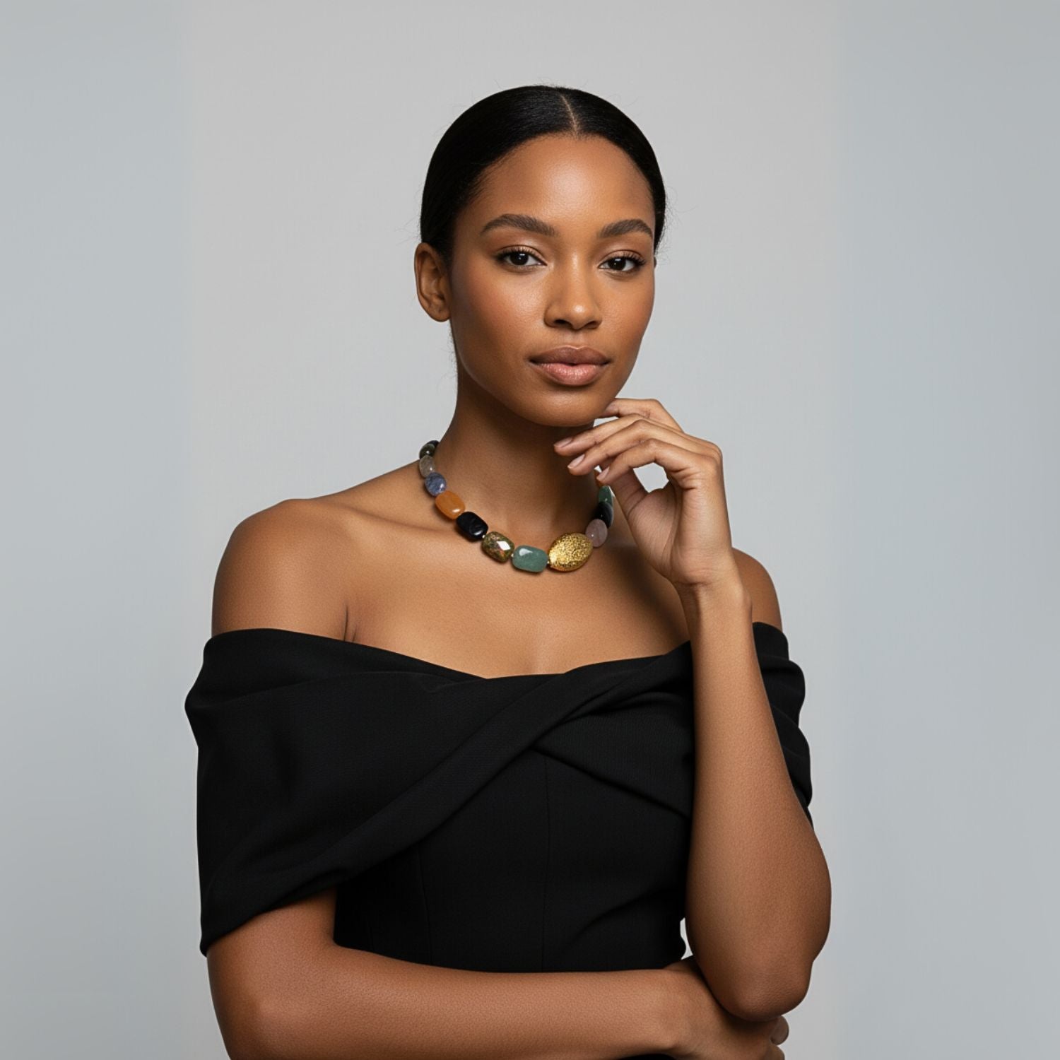 Make a bold statement with the Earthen Elegance Gemstone Necklace by JAREDJAMIN Jewelry Online, featuring chunky, rectangular colorful stones and a large oval gold-patterned bead, finished with a gold toggle clasp.