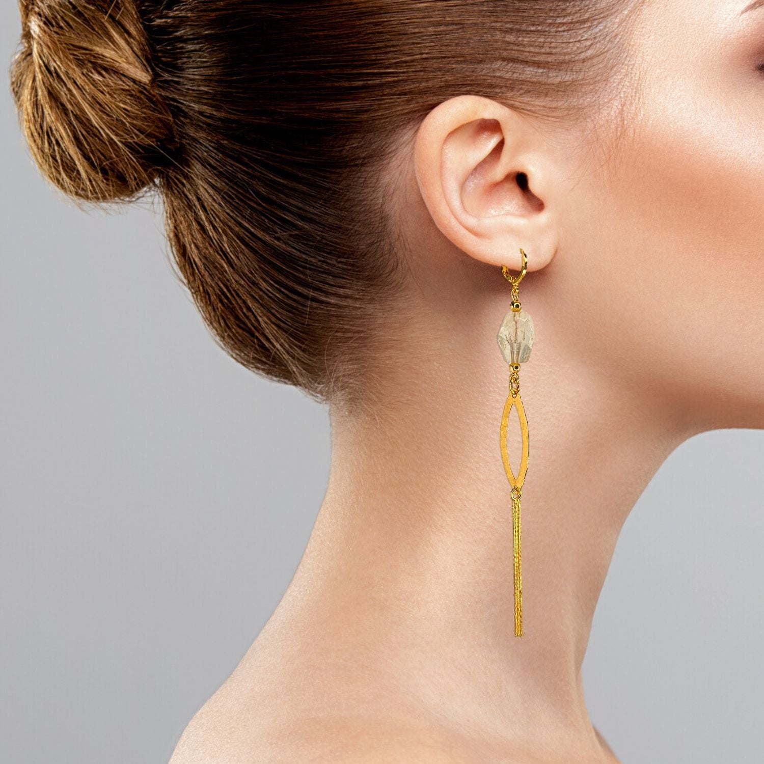 The Eyelet Citrine Dangle Earrings by JAREDJAMIN Jewelry Online feature faceted clear oval citrines, textured gold hammered eyelet marquise hoops, slender chain tassels, 18K gold plating, and secure gold hooks.