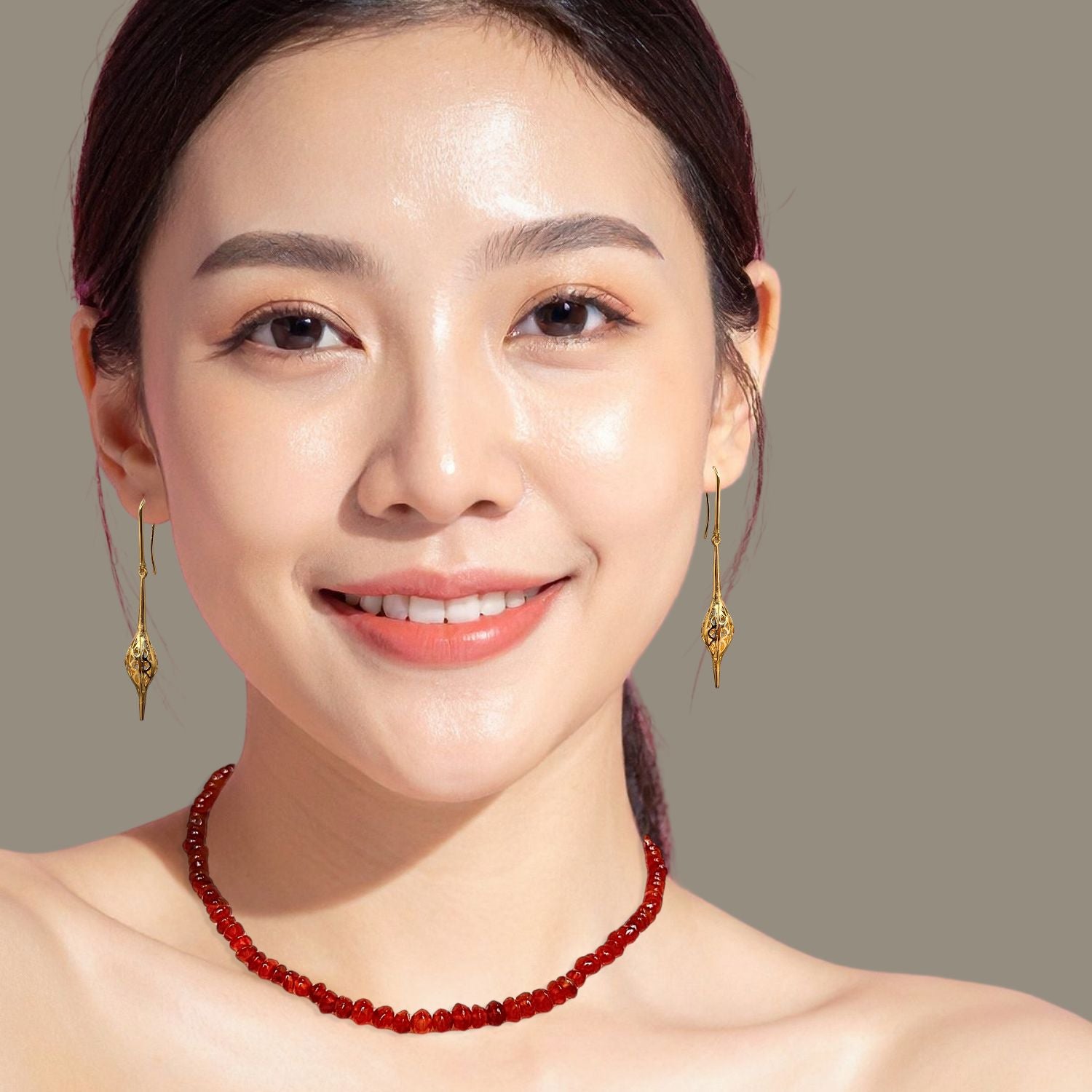 The Gemstone Trail Carnelian Necklace by JAREDJAMIN Jewelry Online features small faceted red beads and a gold adjustable chain with a rectangular tag, blending vitality with simple elegance.
