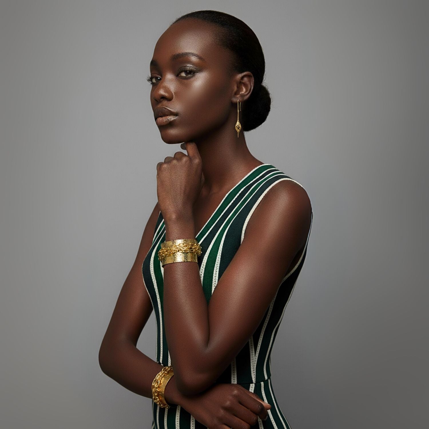 The Gold Jeannie Drop Hook Earrings by JAREDJAMIN Jewelry Online feature elegant 18K gold plating, elongated French hooks, and intricate, hollow teardrop designs with delicate openwork for a lightweight, whimsical look.