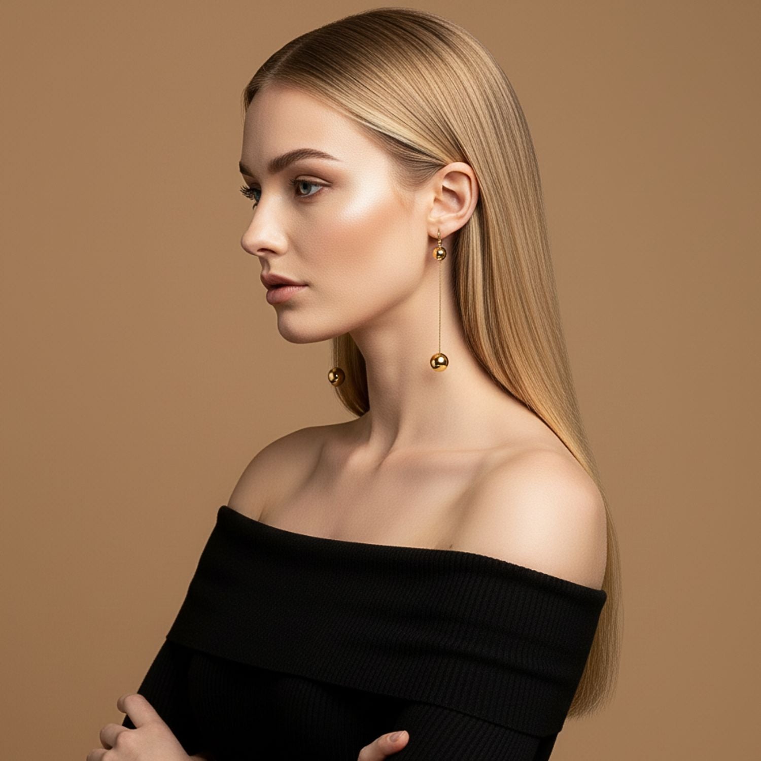 The Gold Orbita Swing Hook Earrings by JAREDJAMIN Jewelry Online feature minimalist 18k gold spheres connected by a slim rod, creating a modern vertical drop for an elegant look.