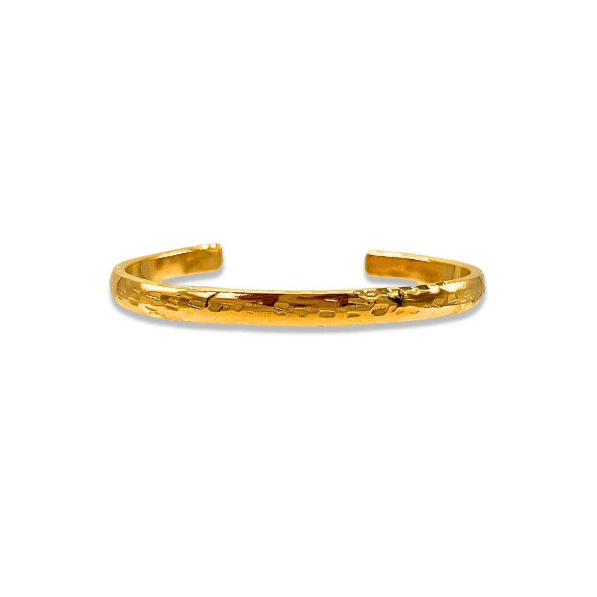 A close-up of the Gold Parker Textured Cuff by JAREDJAMIN Jewelry Online, an open-ended 18K gold plated bracelet with a hand-hammered finish, gleaming with a polished, minimalist elegance against a white background.
