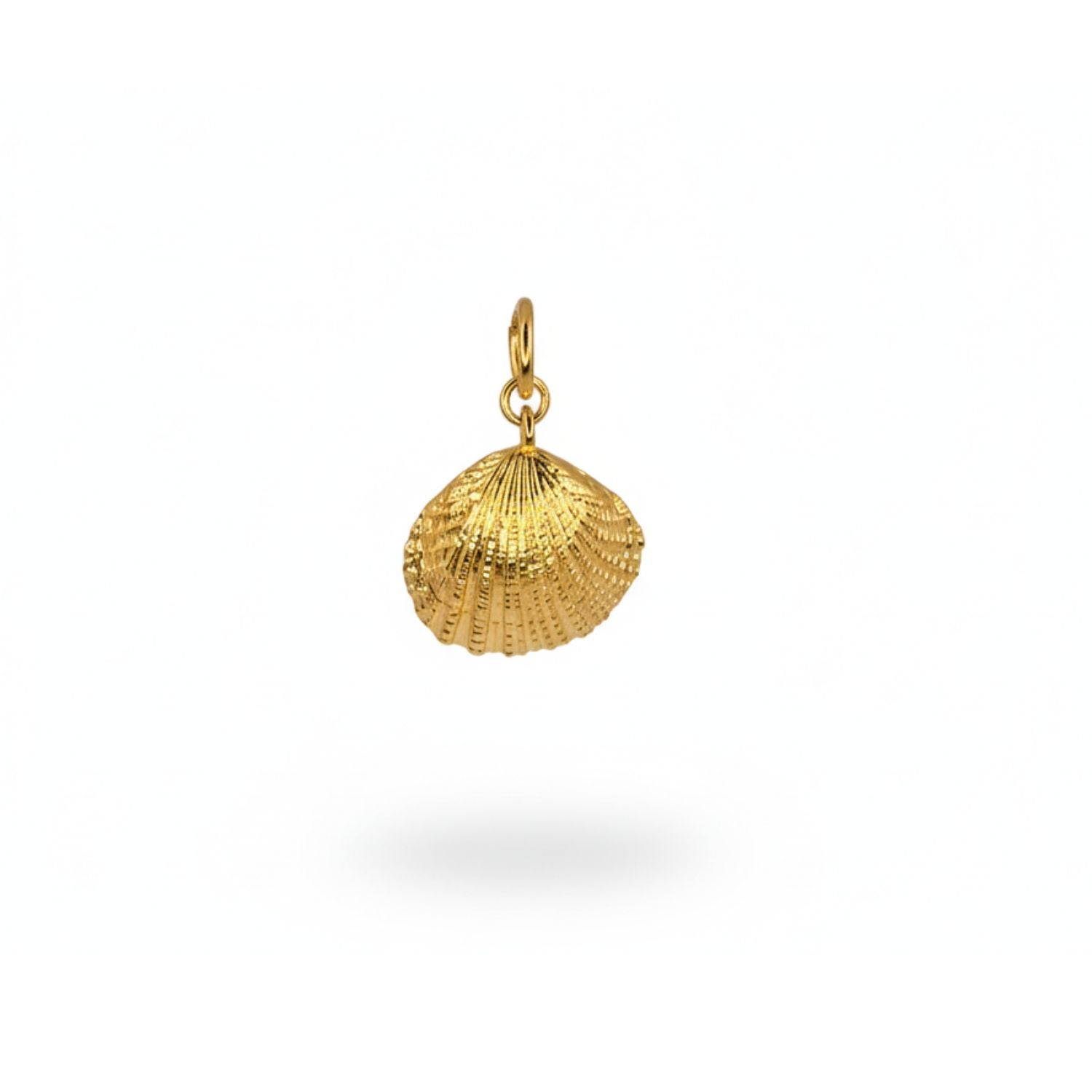 The Hidden Glimmer Pendant Charm by JAREDJAMIN Jewelry Online is an 18k gold-plated, round seashell necklace with a ridged edge, shiny dome center, and a slightly asymmetrical textured design.