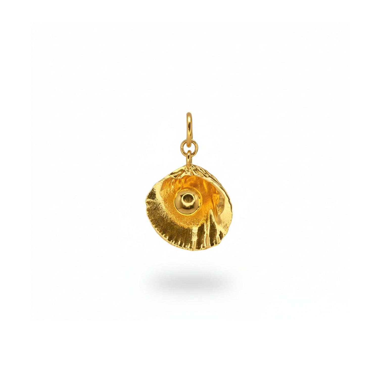 The Hidden Glimmer Pendant Charm by JAREDJAMIN Jewelry Online is an 18k gold-plated, round seashell necklace with a ridged edge, shiny dome center, and a slightly asymmetrical textured design.