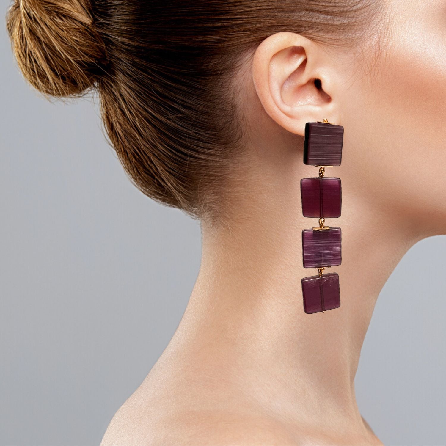 The Hollywood Squares Clip On Earrings from JAREDJAMIN Jewelry Online add retro flair to any outfit. Lightweight and comfortable, these purple square dangles are perfect for everyday wear.