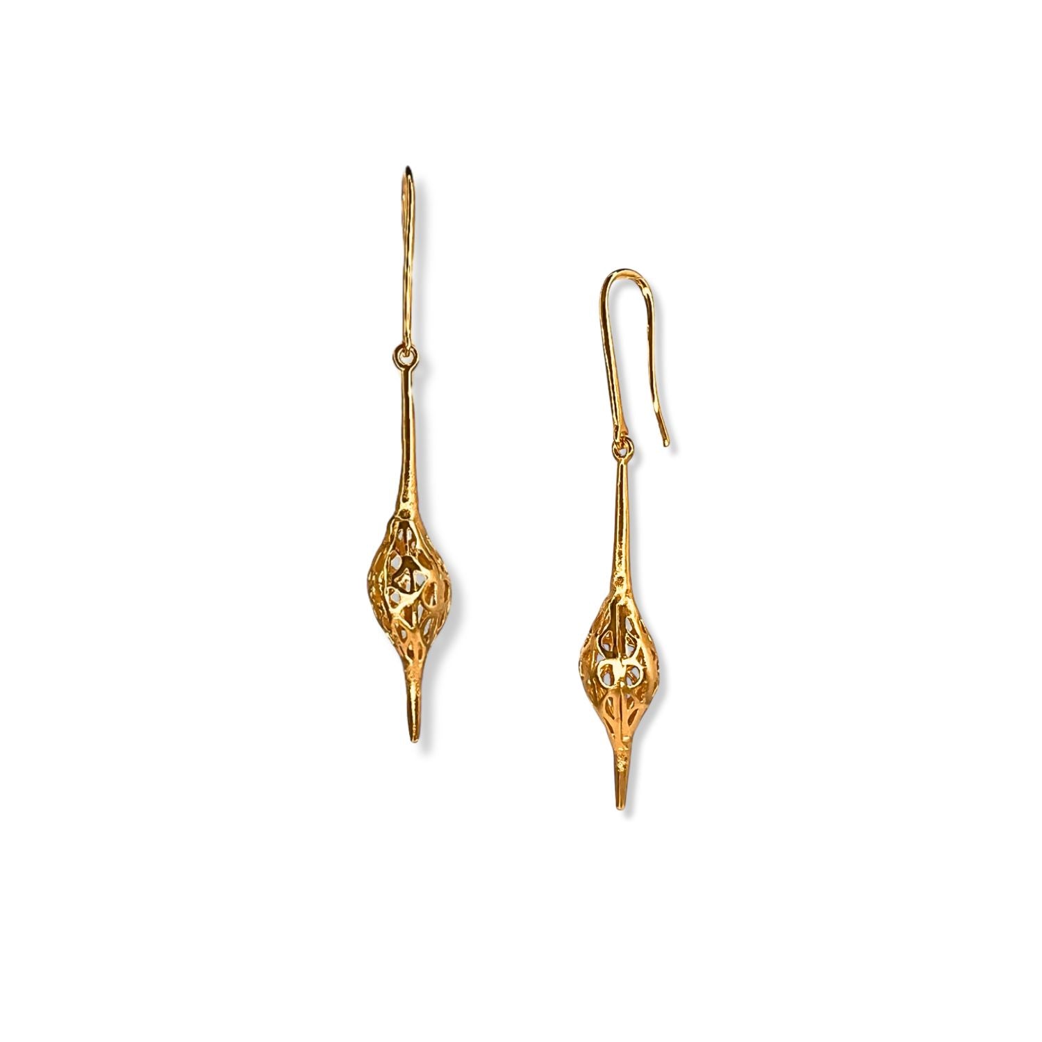 The Gold Jeannie Drop Hook Earrings by JAREDJAMIN Jewelry Online feature elegant 18K gold plating, elongated French hooks, and intricate, hollow teardrop designs with delicate openwork for a lightweight, whimsical look.
