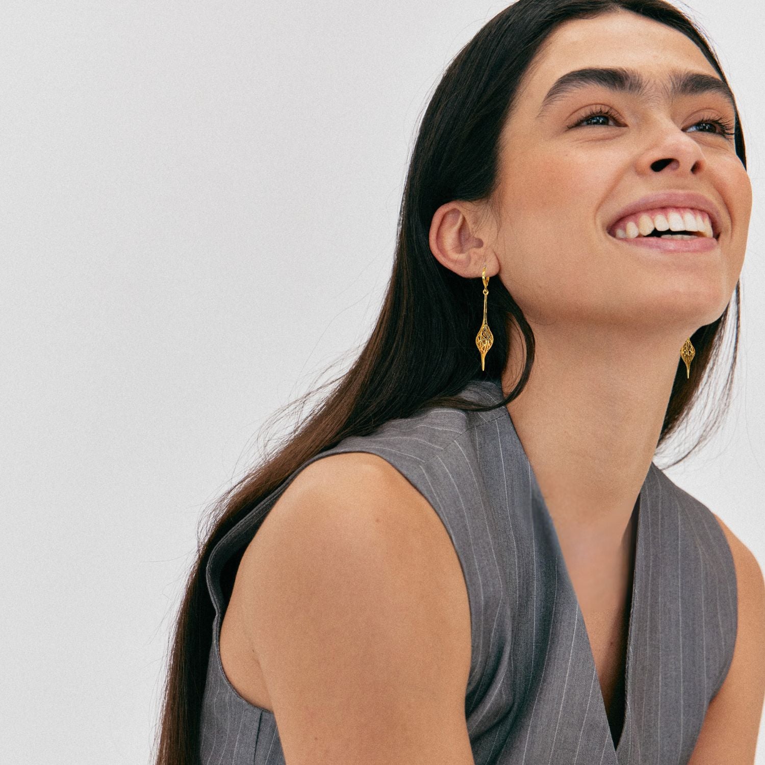 The Jeannie Drop Lever Back Earrings by JAREDJAMIN Jewelry Online feature 18K gold plating, small lever back clasps, and long, textured teardrop-shaped openwork pendants—stylish pierced dangle drops for any occasion.