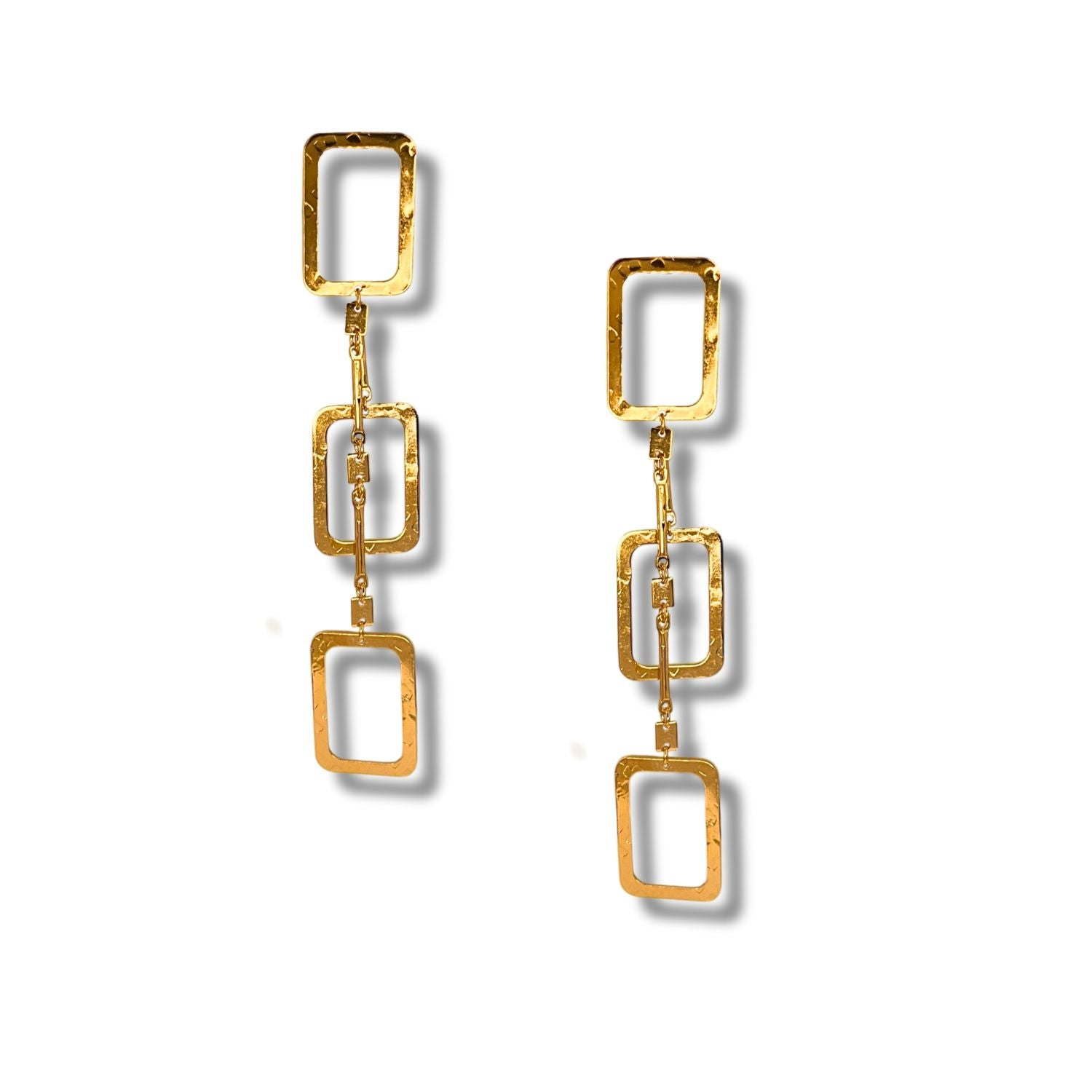 The Lattice of Gladys Double-Tiered Dangle Post Earrings by JAREDJAMIN Jewelry Online feature two linked, hammered gold rectangles hanging vertically against a white background.