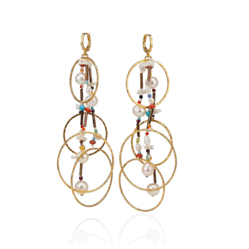 The Lindy Dream Catcher Dangle Earrings by JAREDJAMIN Jewelry Online feature three interlocking gold hoops per earring, adorned with colorful beads, pearls, and delicate gold rods for an elegant bohemian look.