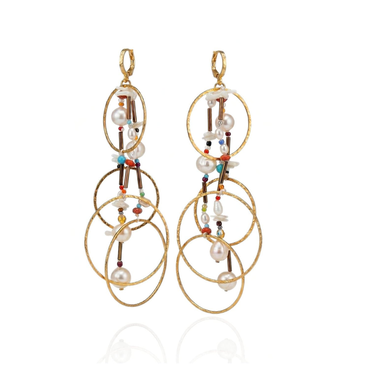 The Lindy Dream Catcher Dangle Earrings by JAREDJAMIN Jewelry Online feature three interlocking gold hoops per earring, adorned with colorful beads, pearls, and delicate gold rods for an elegant bohemian look.