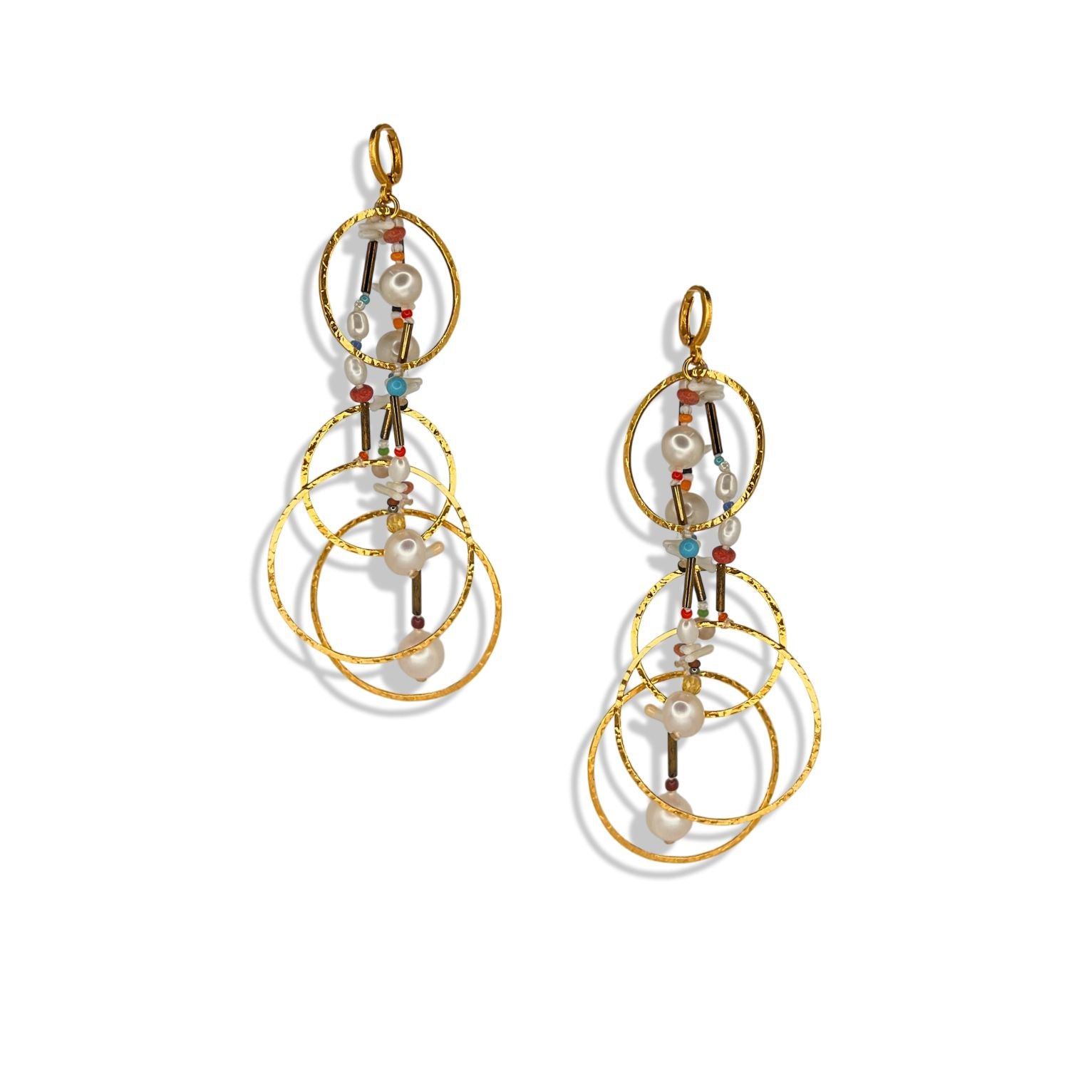 The Lindy Dream Catcher Dangle Earrings by JAREDJAMIN Jewelry Online feature three linked 18K gold hoops with white pearls, colorful beads, and metallic bars in a layered cascade, shown against a white background.