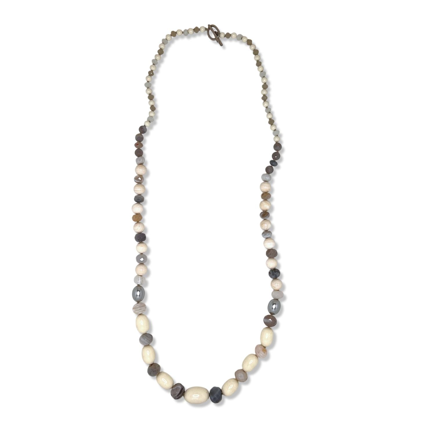 The Montana Quarry Necklace by JAREDJAMIN Jewelry Online features vintage lucite beads in alternating cream, gray, and brown round and oval shapes, arranged symmetrically with a small clasp, displayed on a white background.
