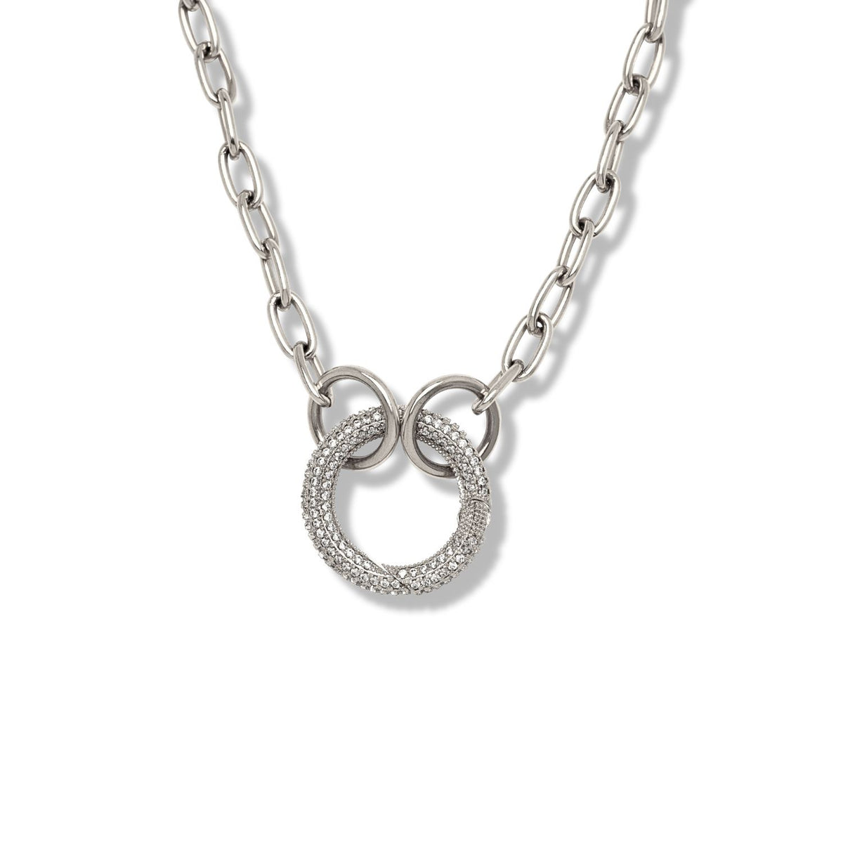 The JAREDJAMIN Jewelry Online Reaction Circular Pave Clasp Necklace features three interlocking rings, with the central ring sparkling with clear stones, on an 18-inch chain, beautifully displayed against a plain white background.