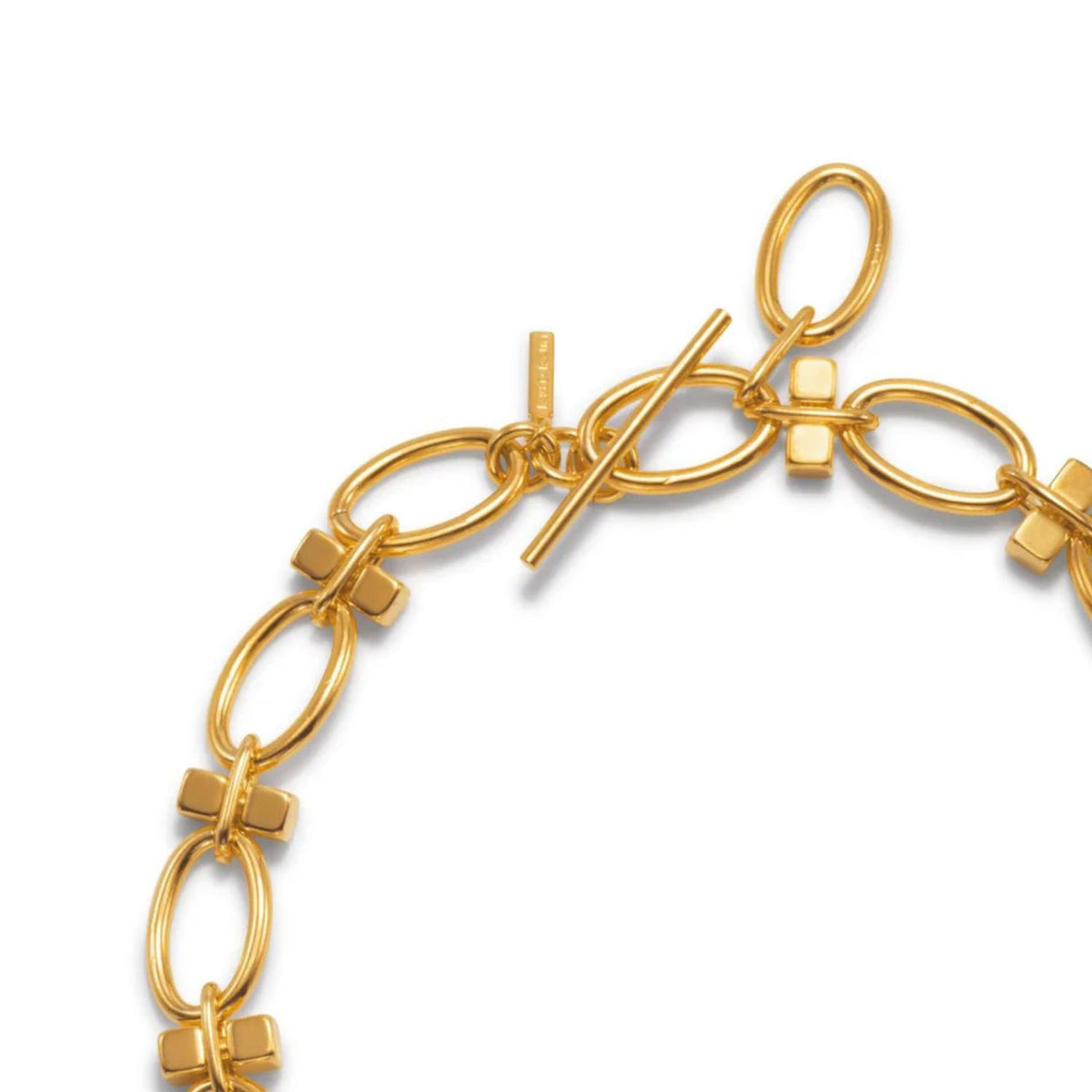A close-up of the Reign Gold Link Bracelet by JAREDJAMIN Jewelry Online, featuring oval links with small cross-shaped connectors and an adjustable toggle clasp. The 18K gold plated bracelet is shown against a plain white background.