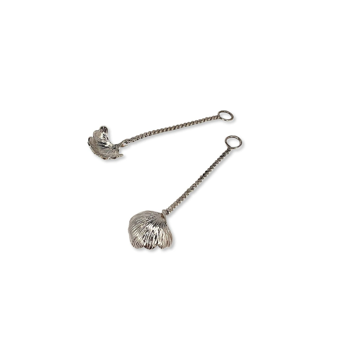 The Silver Gingko Salt Spoon Condiment Spoons Set by JAREDJAMIN Barware and More features two small silver-plated spoons with textured gingko charms on thin twisted chains, making them unique dining accessories.