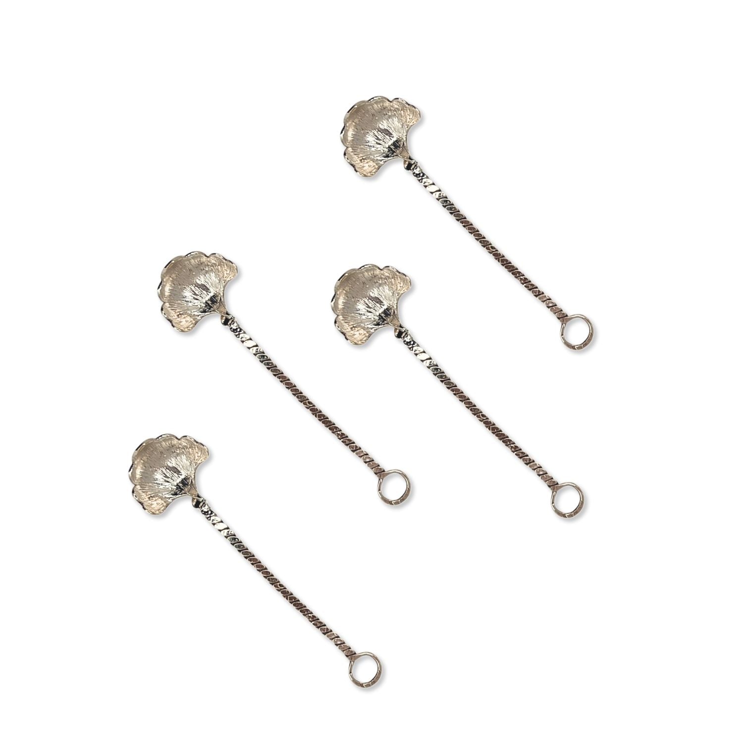 The Silver Gingko Salt Spoon Condiment Spoons Set by JAREDJAMIN Barware and More features four silver-plated spoons with textured shell bowls and twisted handles, adding a touch of elegance to any table setting.