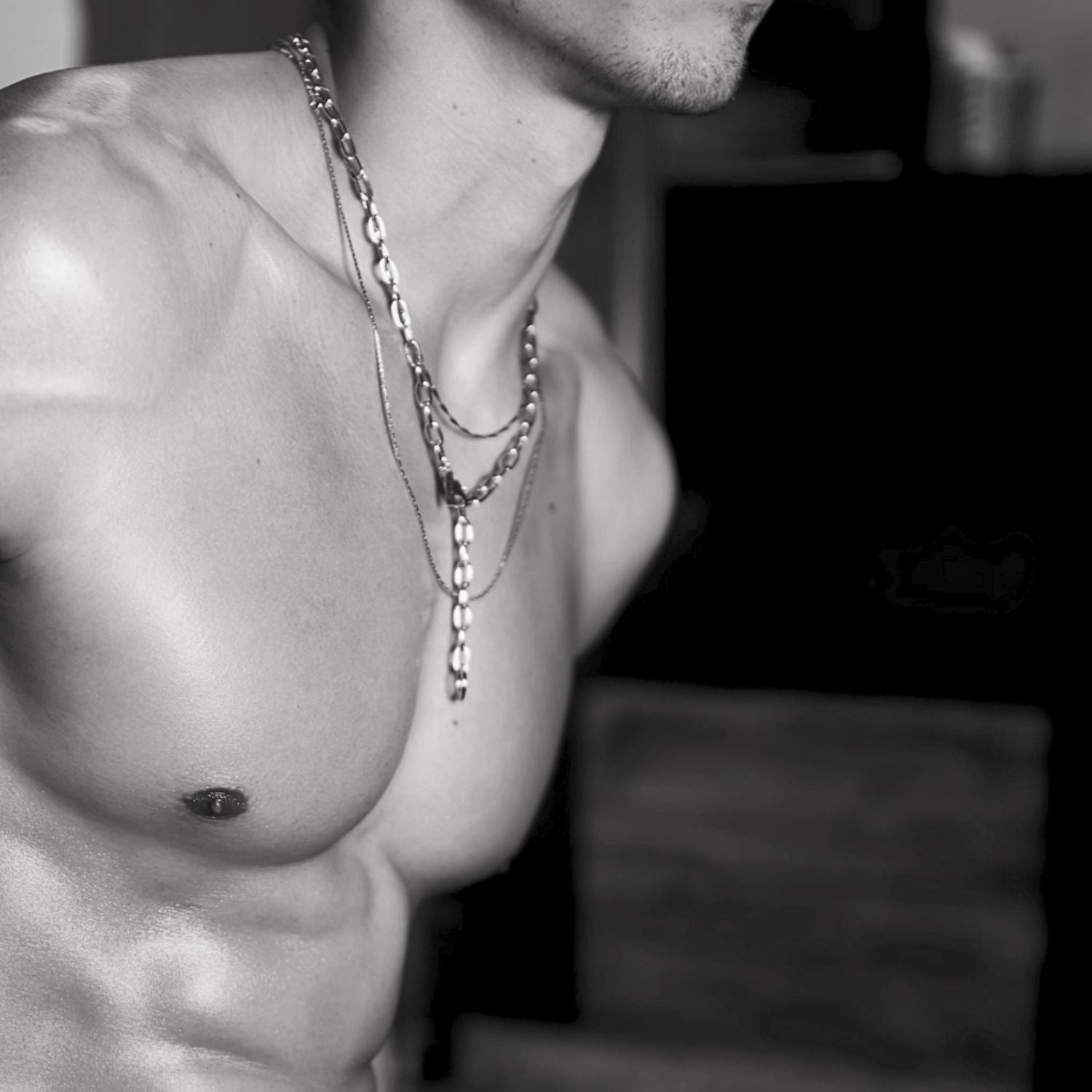 The Silver Chain Reaction Necklace by JAREDJAMIN Jewelry Online features large oval links and a modern lariat design, looping through a central ring to form a striking Y-shape for a bold, minimalist statement.