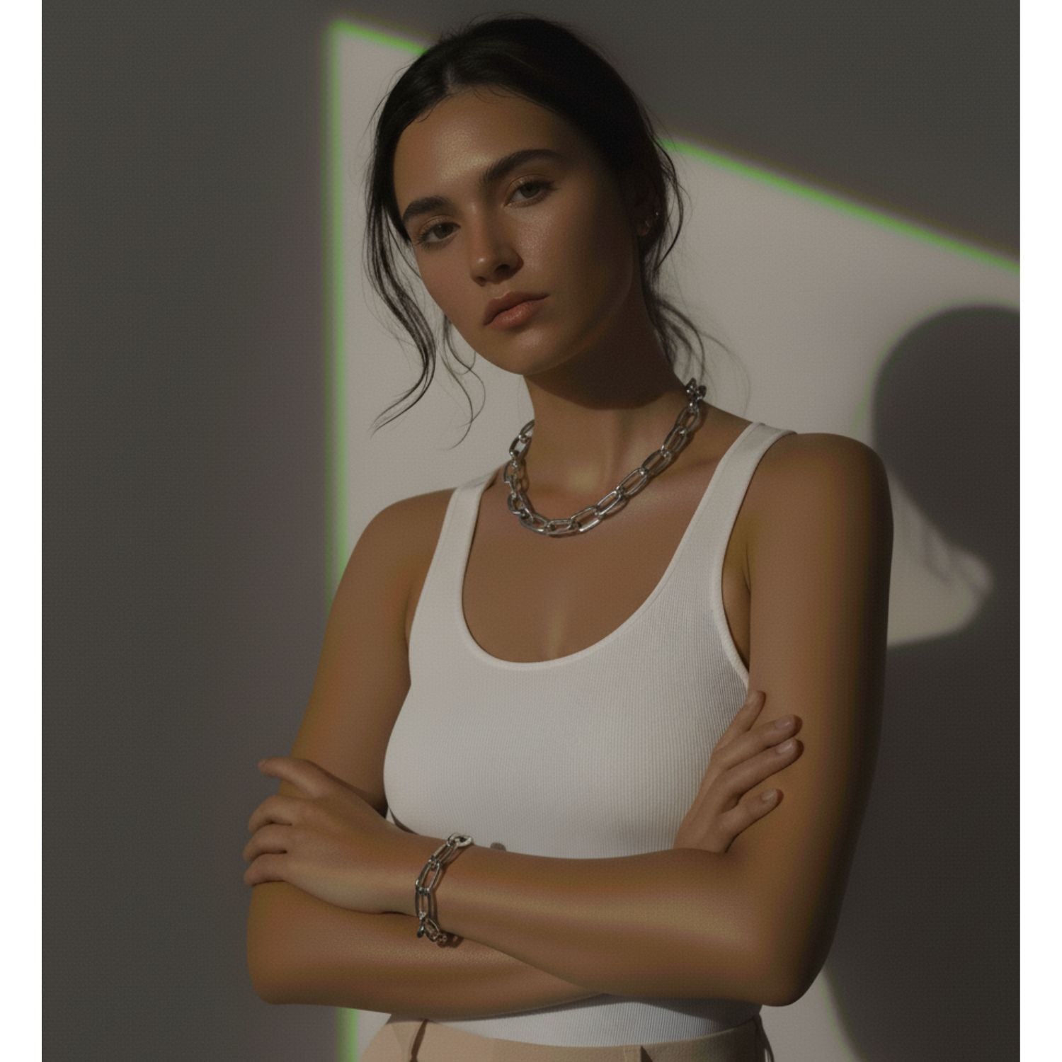 The Silver Everly Chain Necklace by JAREDJAMIN Jewelry Online features large silver-plated oval links in a teardrop shape, accented with a central round ring for an industrial touch and polished for a modern, minimalist look.