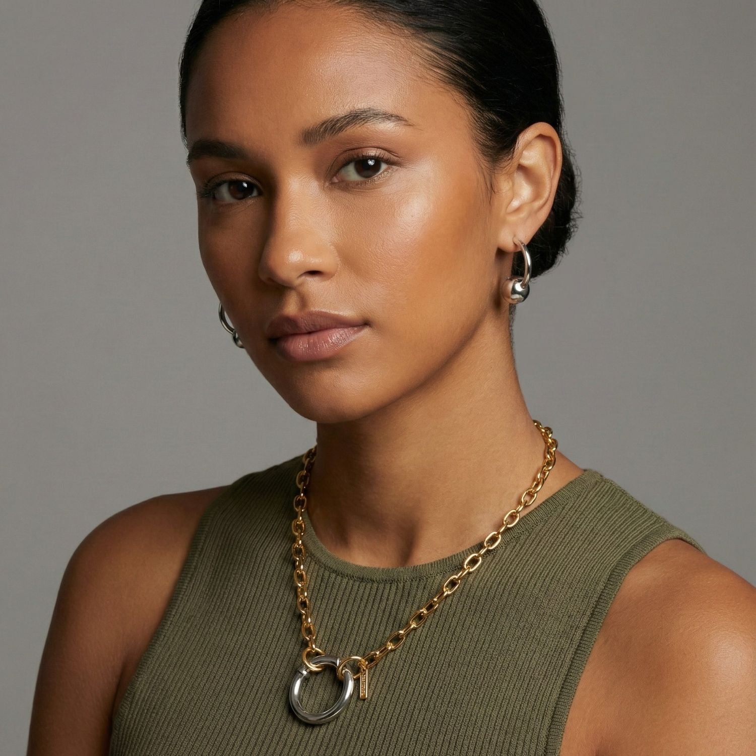 The Silver Orbita-U Post Earrings by JAREDJAMIN Jewelry Online feature a modern, open curved design with secure posts and bold metallic orbs, finished in sleek White Rhodium for a minimalist look.