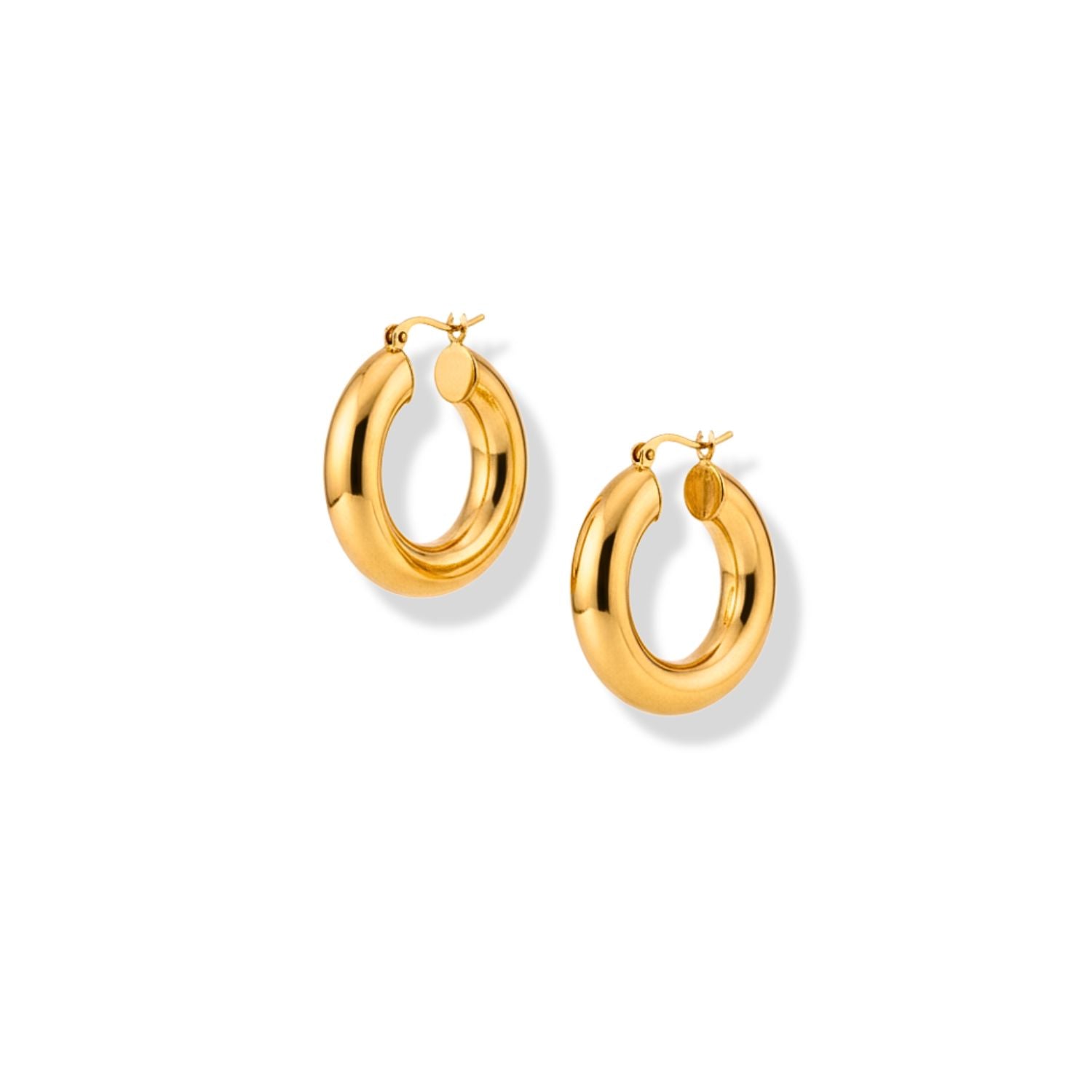 The Smooth Doughnut Hoop Earrings by JAREDJAMIN Jewelry Online feature chunky 18k gold plating and hinge-back clasps, displayed against a white background. Their thick, polished surfaces reflect light, making them ideal for daily wear.