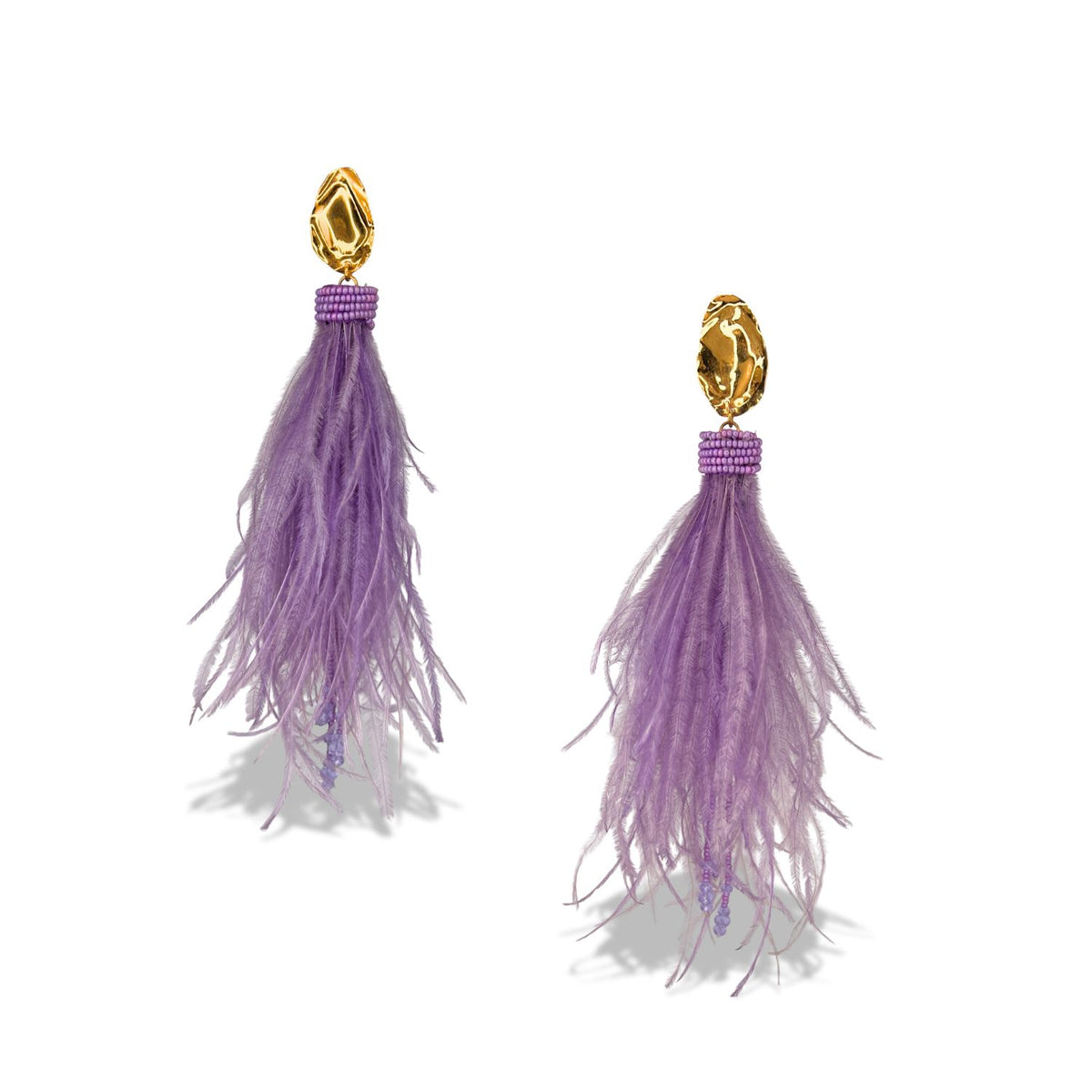 JAREDJAMIN Jewelry Online’s Vegas Vixen Clip Earrings are gold plated statement studs with purple bead clusters and wispy lavender feathers—a bold, voluminous look for dramatic earring lovers.