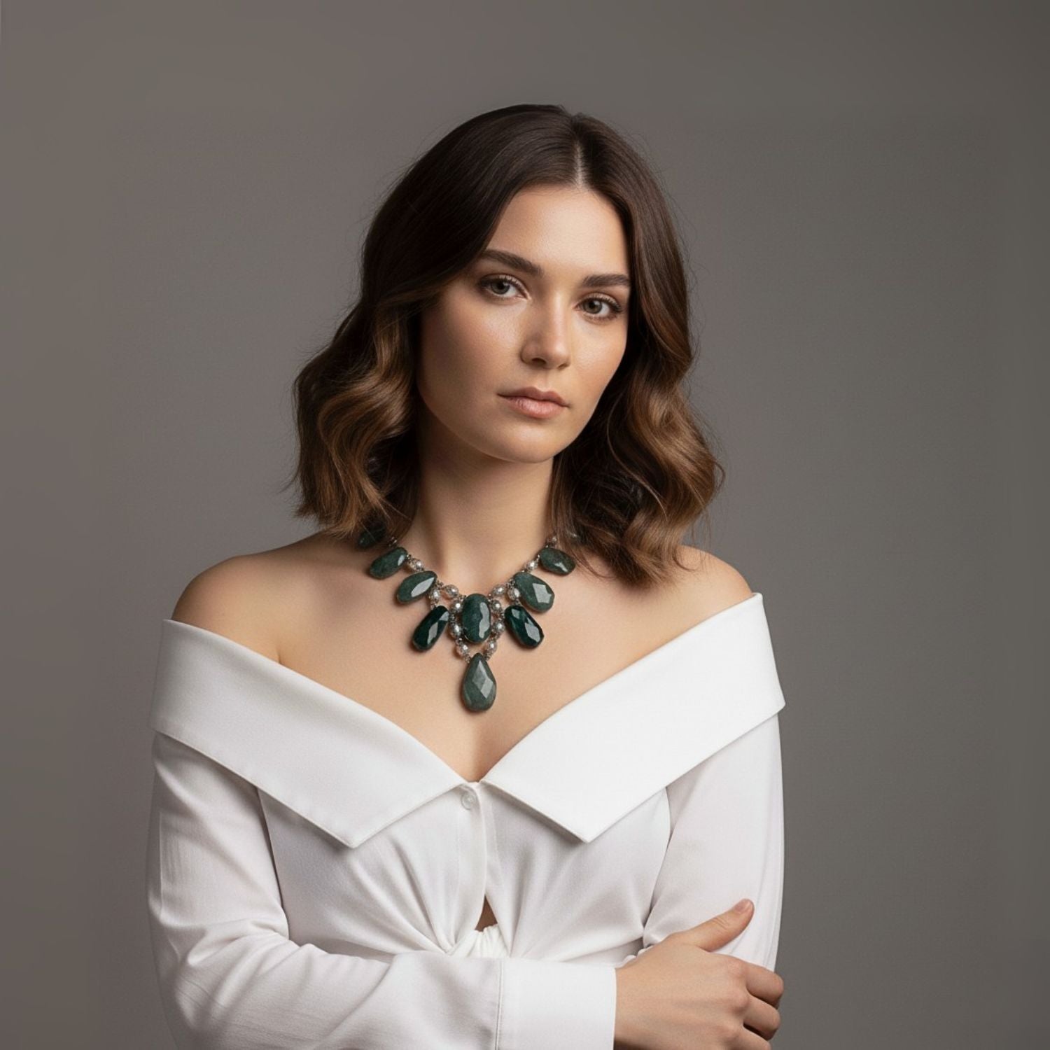 The Versailles Vixen Jasper Necklace by JAREDJAMIN Jewelry Online features large, irregular green Jasper pendants, smaller round beads, and beige oval beads near the metal clasp—all linked by silver wire.