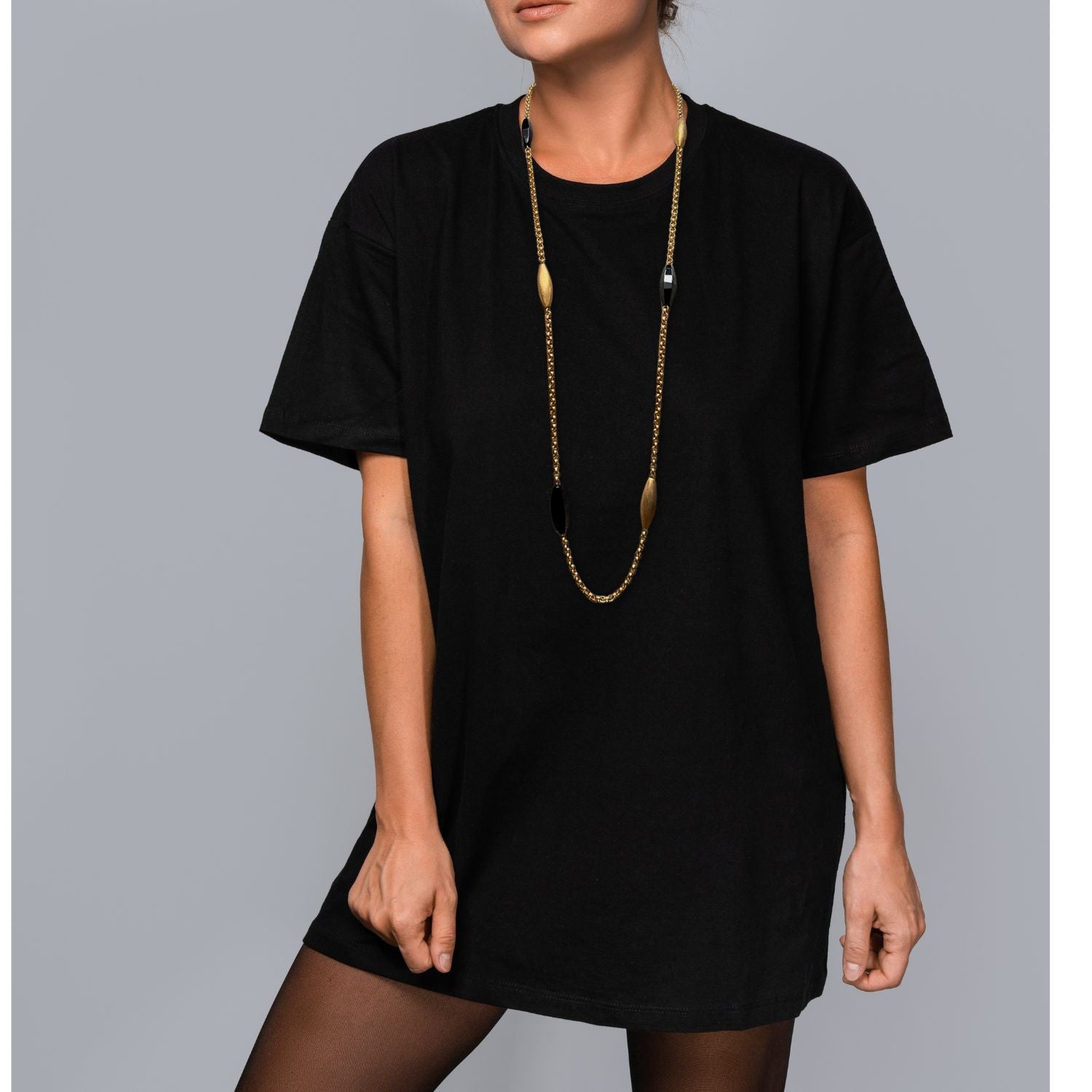 The Zeppelin Luna Onyx Necklace by JAREDJAMIN Jewelry Online features three matte 18k gold oval beads and three glossy black oval beads, evenly spaced on a handcrafted gold chain with a toggle clasp. The design is delicate and elegant against a white background.