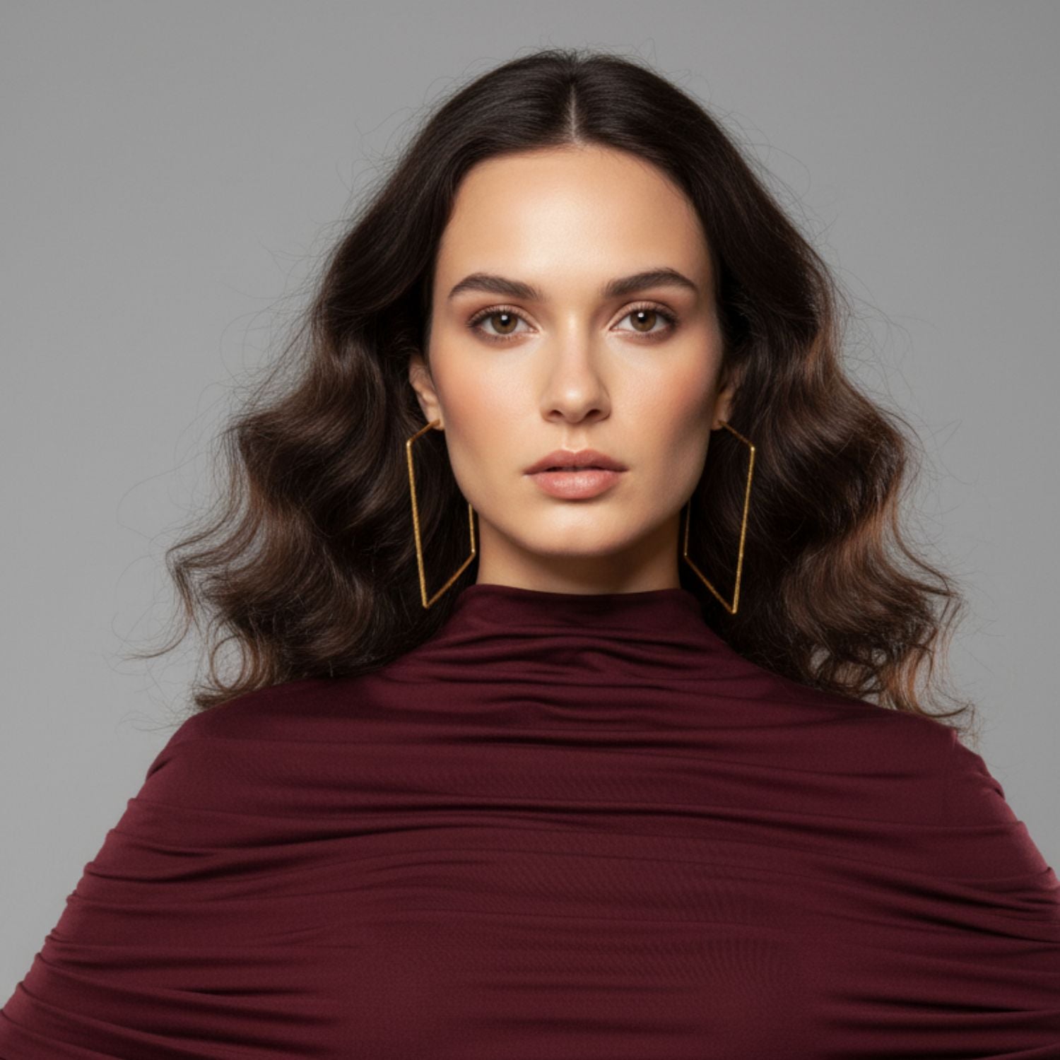 The Gold Squaretastic Hoop Post Earrings by JAREDJAMIN Jewelry Online feature a minimalist, open-ended 18K gold plated design with never-tarnish E-coating and geometric details, shown on a plain white background.