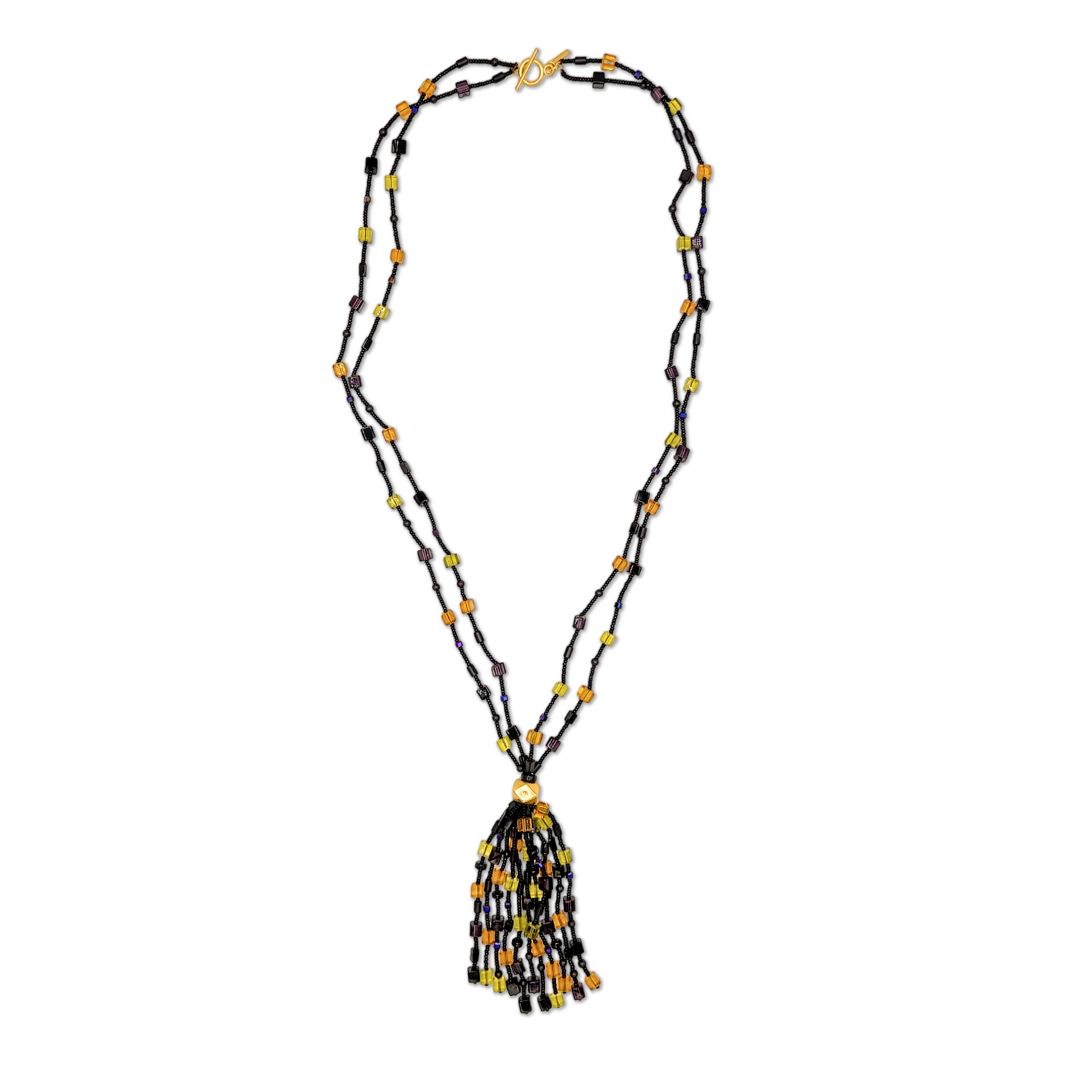 The Cubism Tassel Necklace by JAREDJAMIN Jewelry Online features two black strands with yellow, orange, green, and purple beads, joined at a geometric gold bead and finished with a matching tassel and gold toggle clasp.