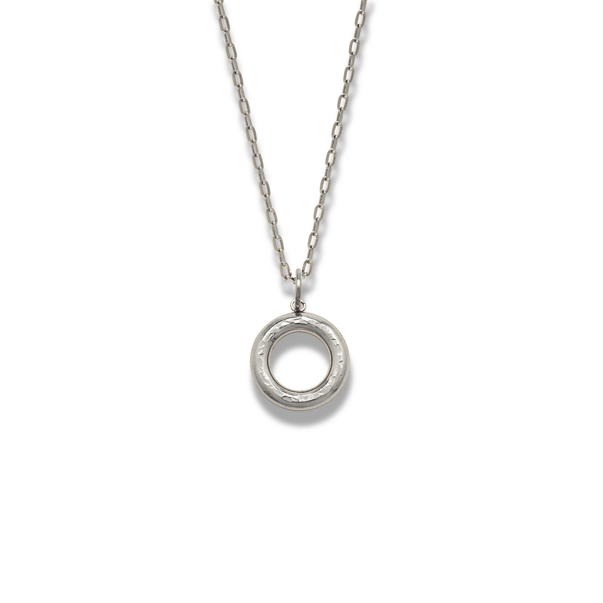 The JAREDJAMIN Jewelry Online Gold Hammered Doughnut Pendant Necklace features a slightly textured, hollow-center, circular pendant on an oval-link chain, displayed on a white background with a soft shadow.