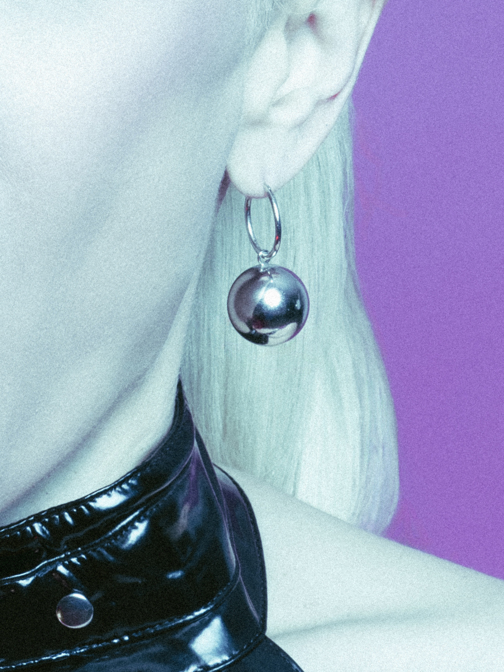 The Silver Orbita Ball Charm Click-Top Hoop Earrings by JAREDJAMIN Jewelry Online feature shiny round metallic balls dangling from each hoop, displayed on a plain white background with bright highlights and soft shadows.