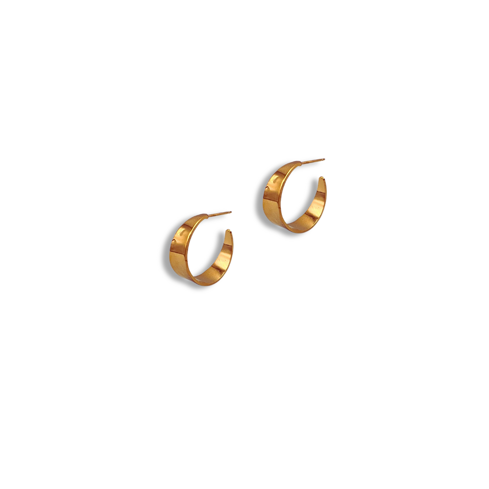The Gold Gaby Hoop Earrings by JAREDJAMIN Jewelry Online are petite, 18K gold hoops with a smooth, shiny finish. Shown on a white background, these partial-circle earrings have thin posts and cast soft shadows—ideal for daily wear.